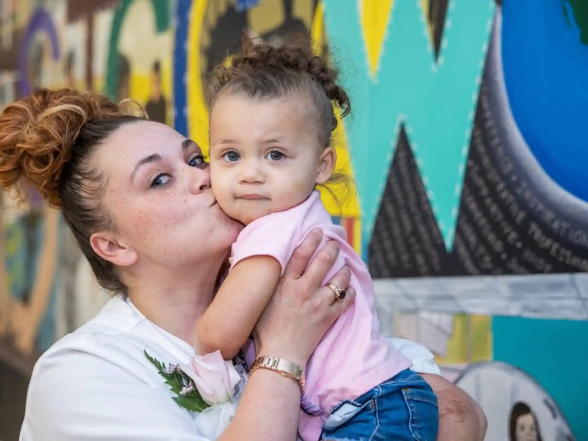 a person holding a baby