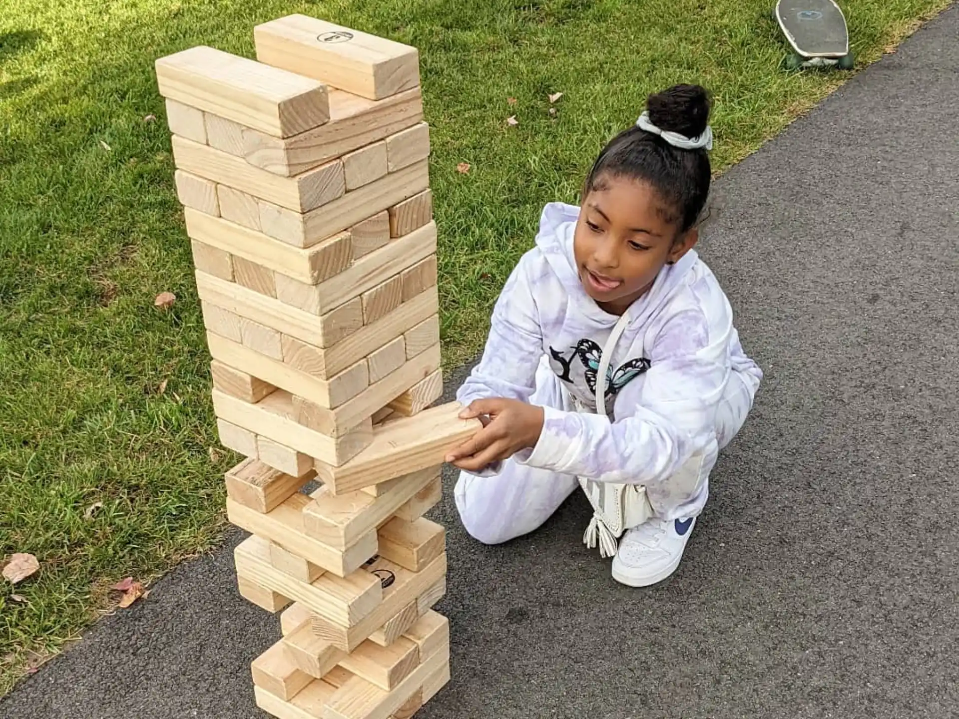 a girl playing with wooden blocks