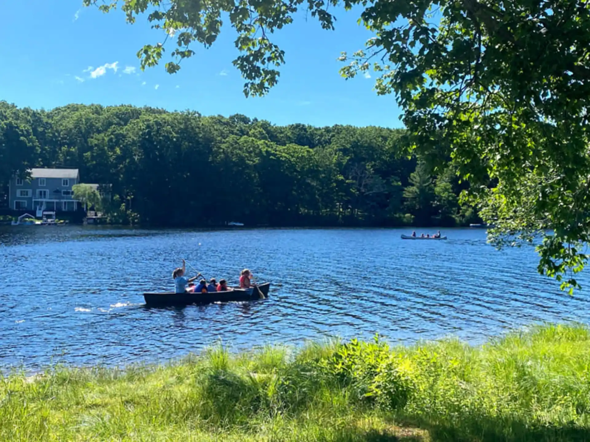 a group of people in a boat on a lake