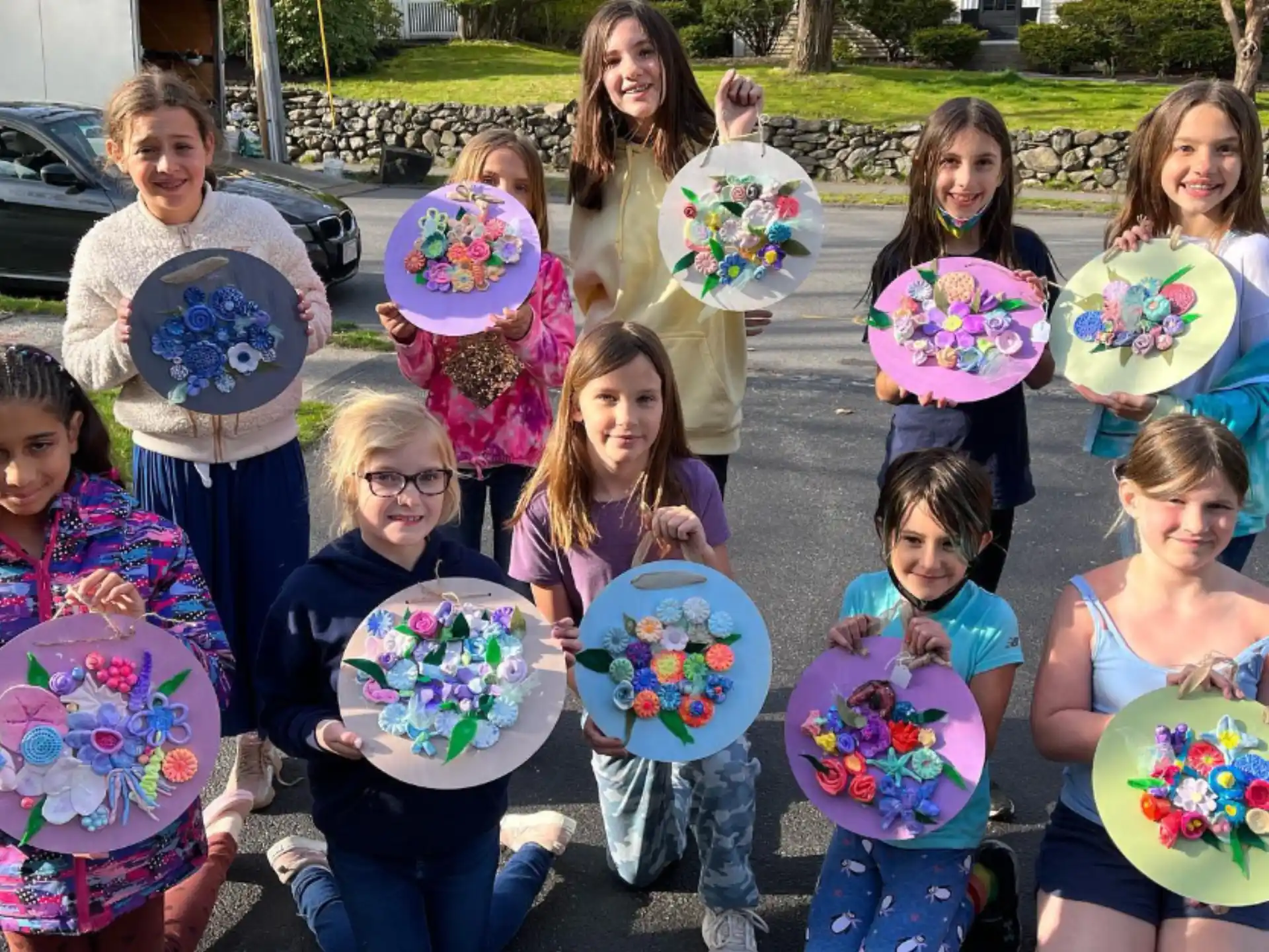 a group of children holding flowers