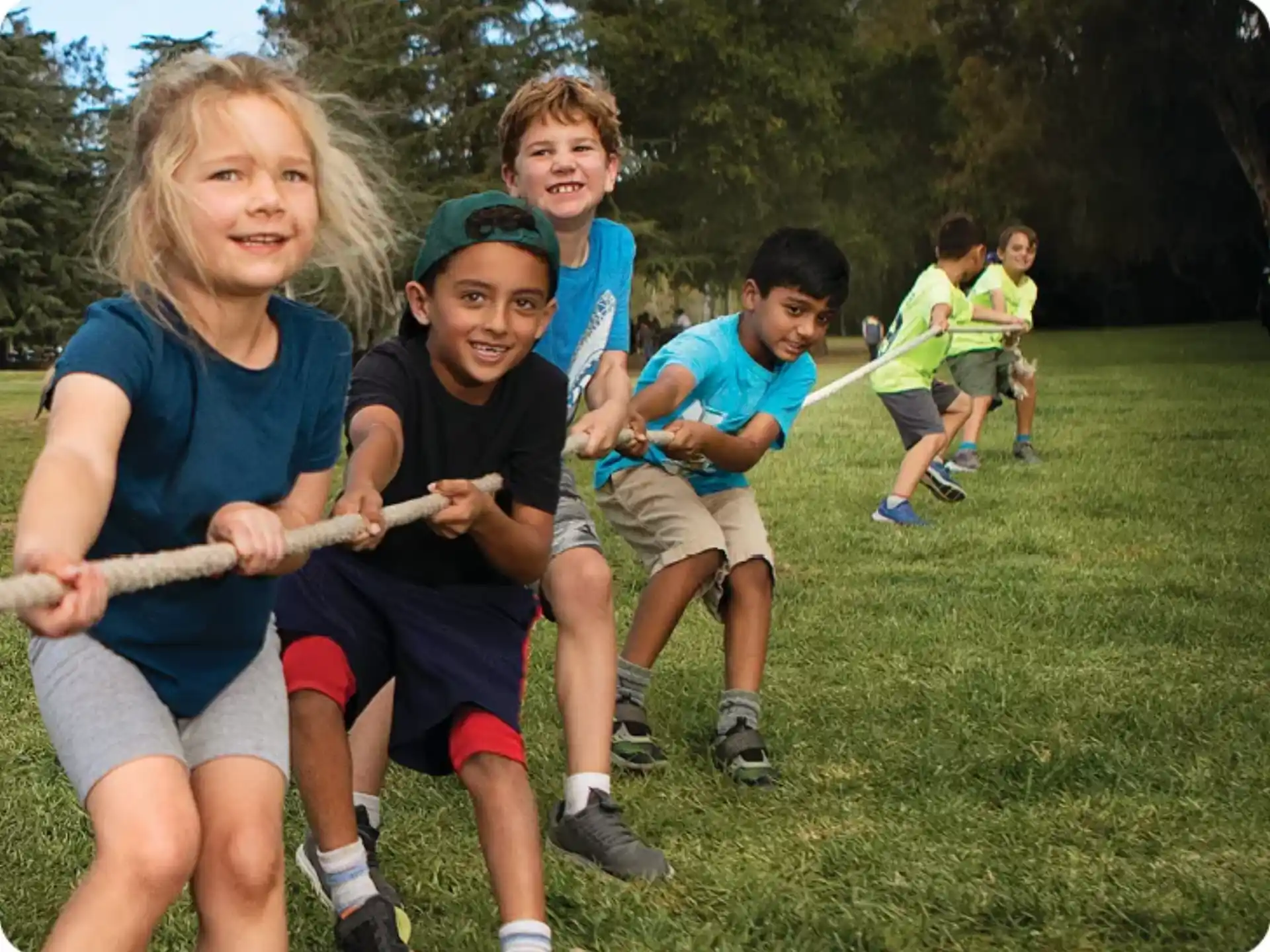 a group of kids playing with a stick