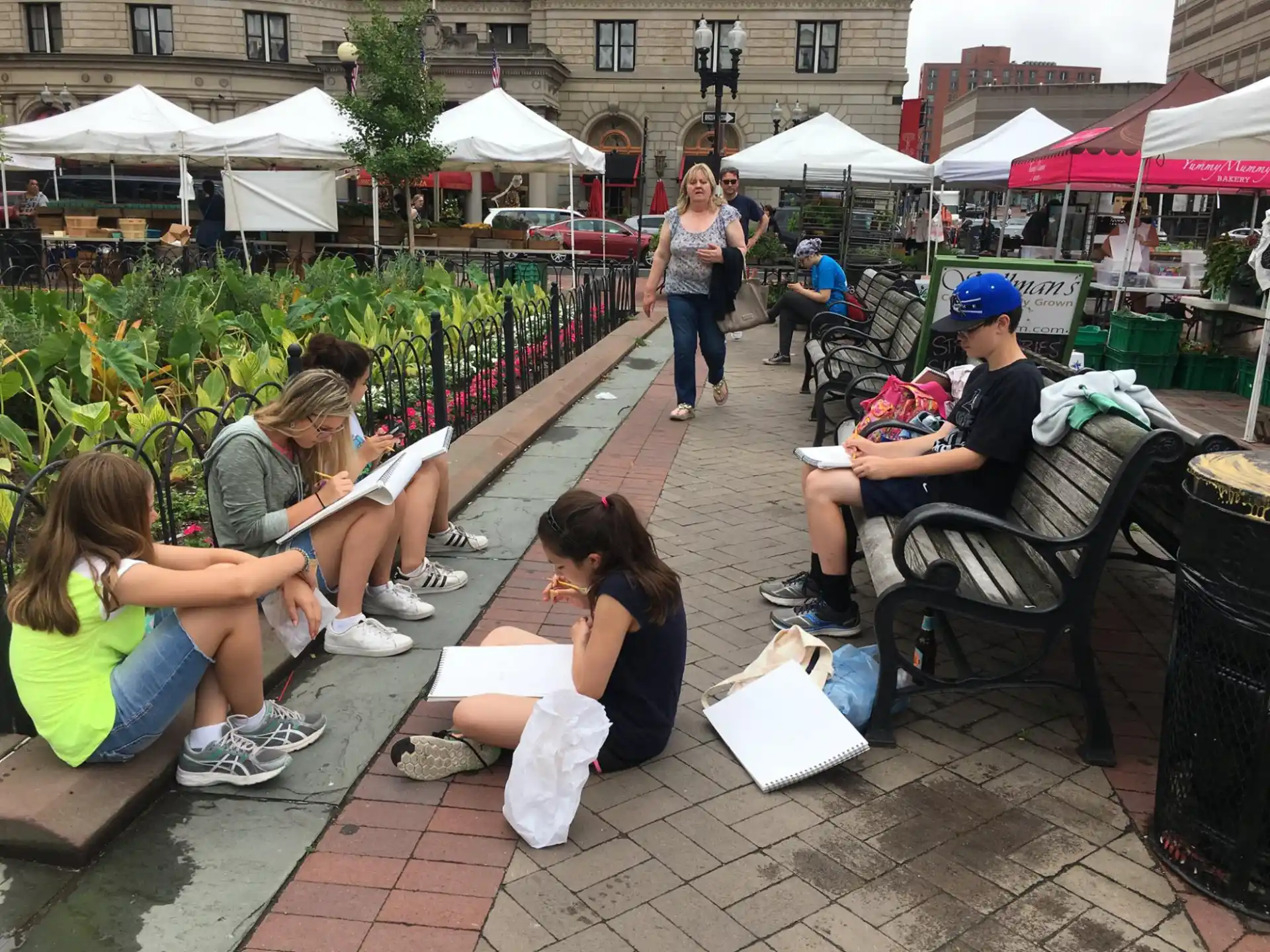 a group of people sitting on a bench