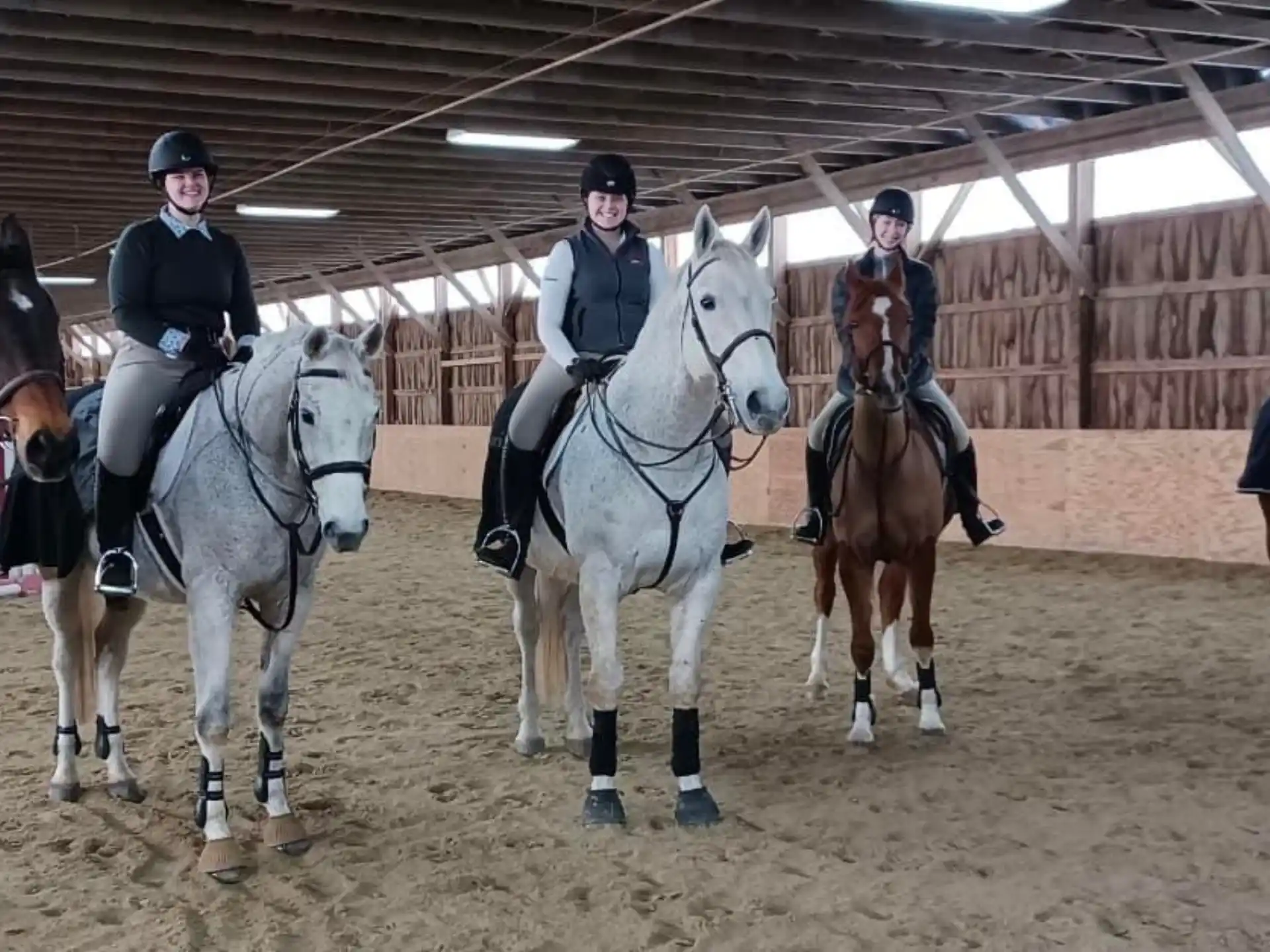 a group of people riding horses