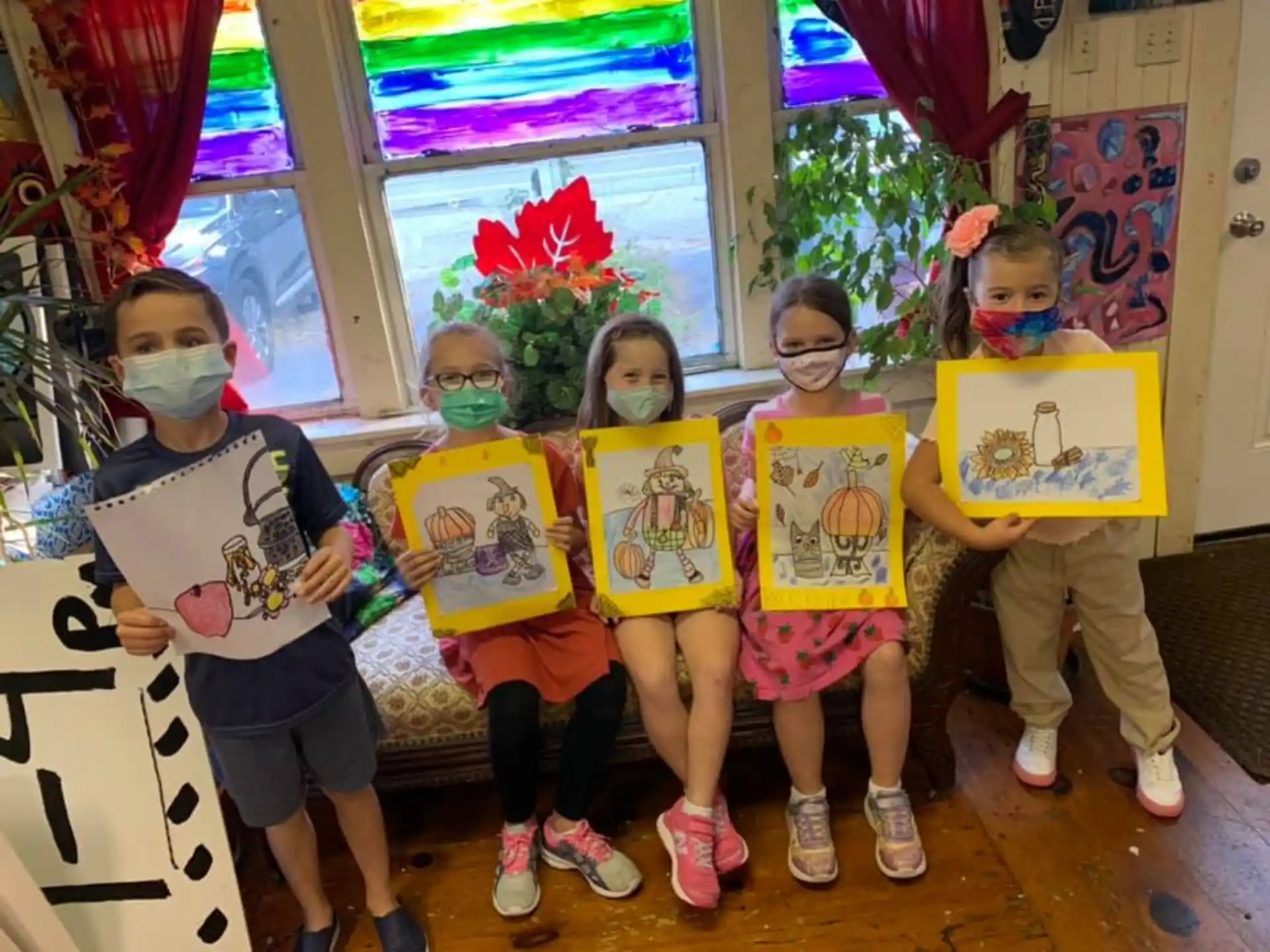 a group of children holding signs