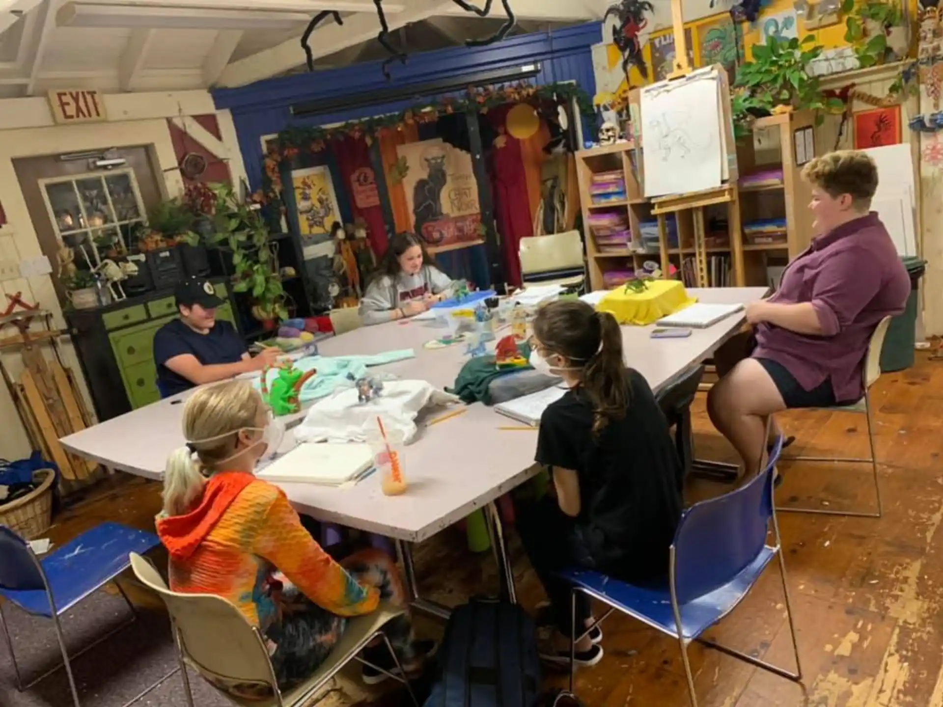 a group of people sitting around a table