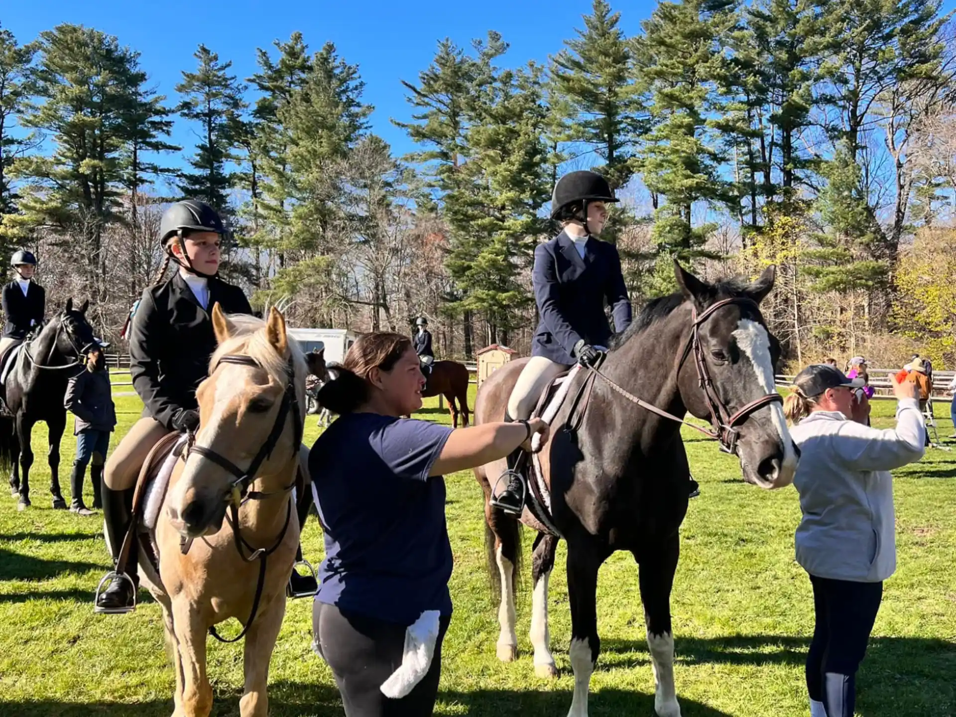 a group of people riding horses