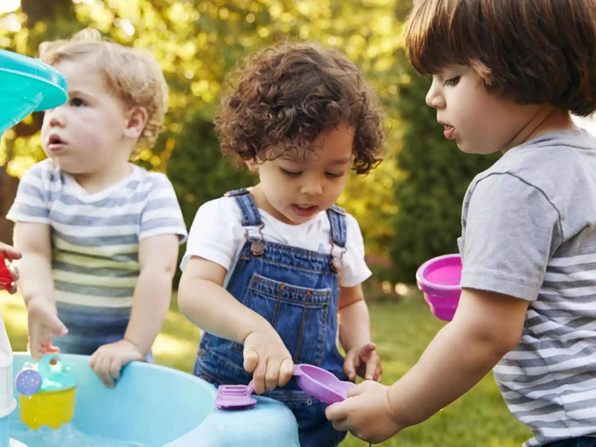 a group of children playing with toys