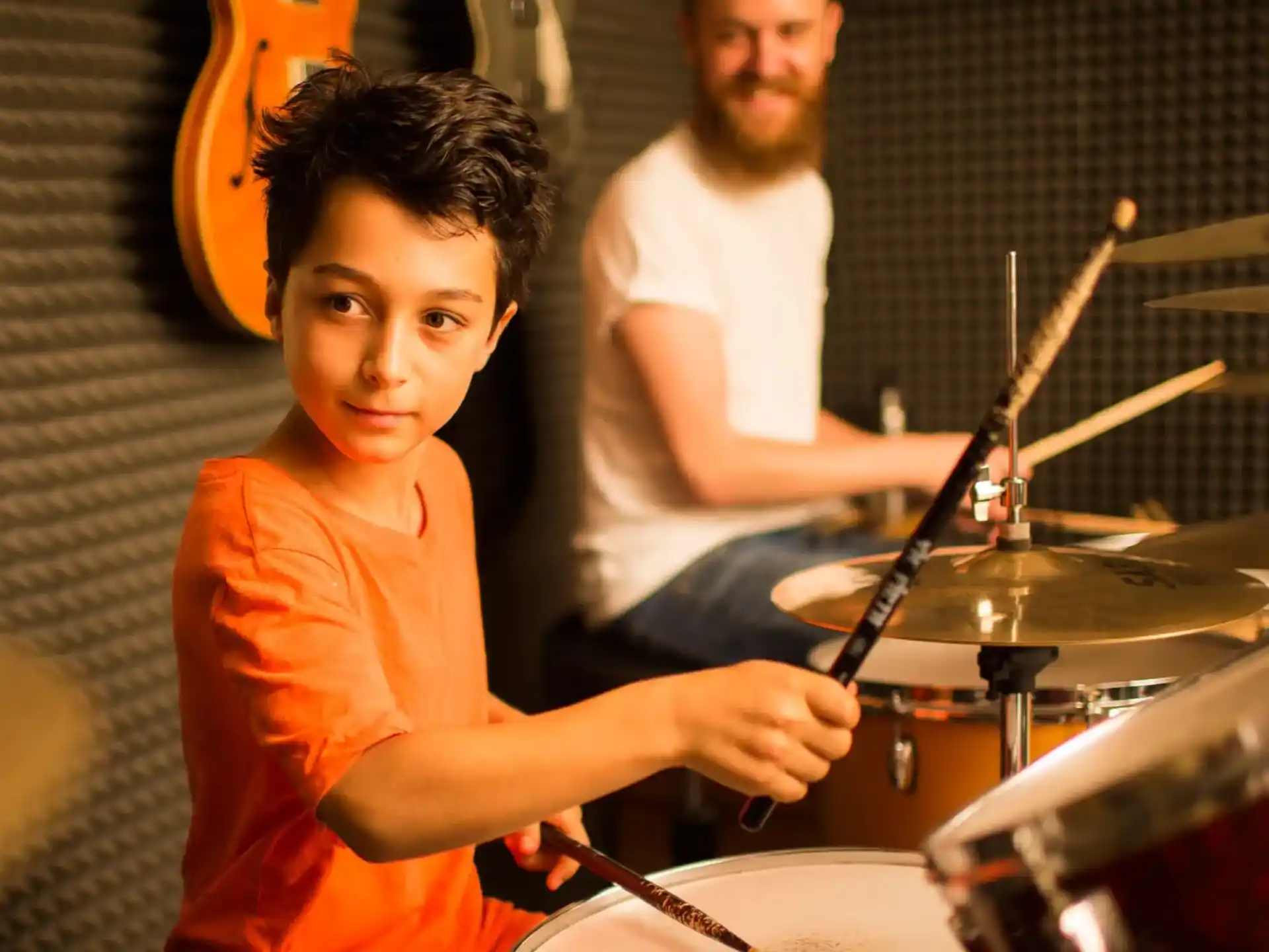 a boy playing drums