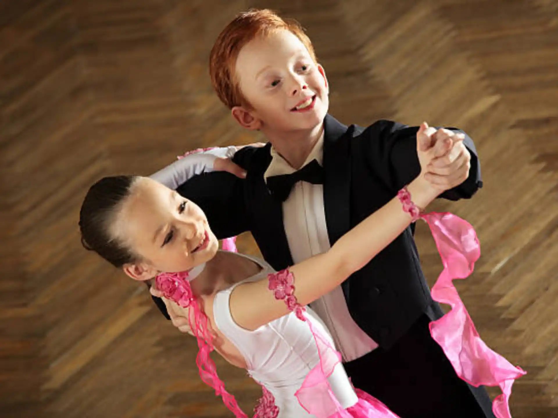 a boy and girl posing for a picture