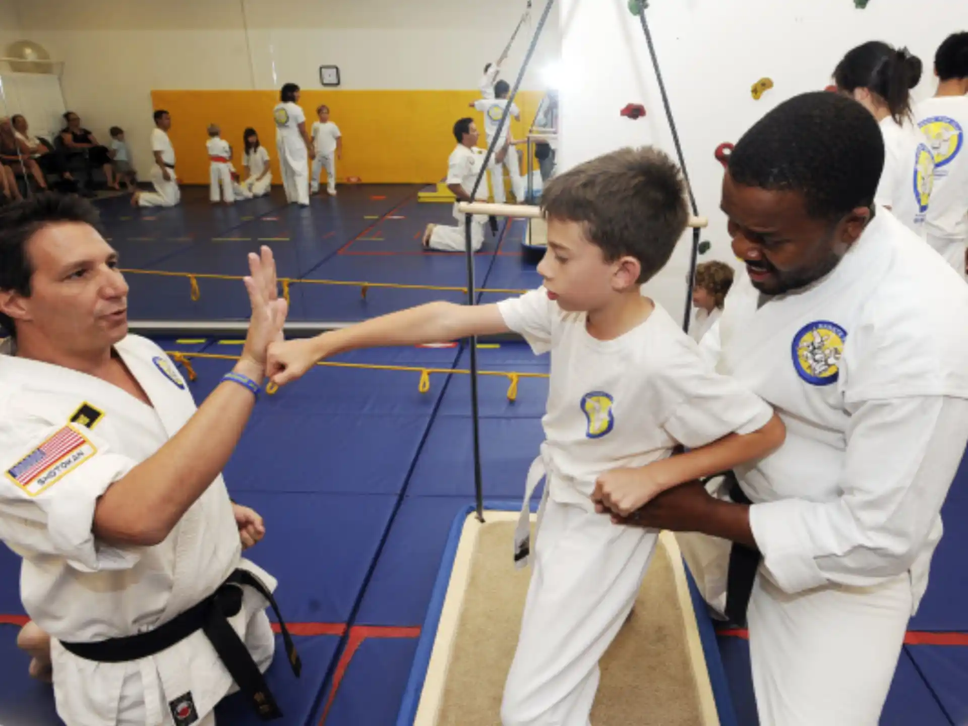 a group of boys in karate uniforms