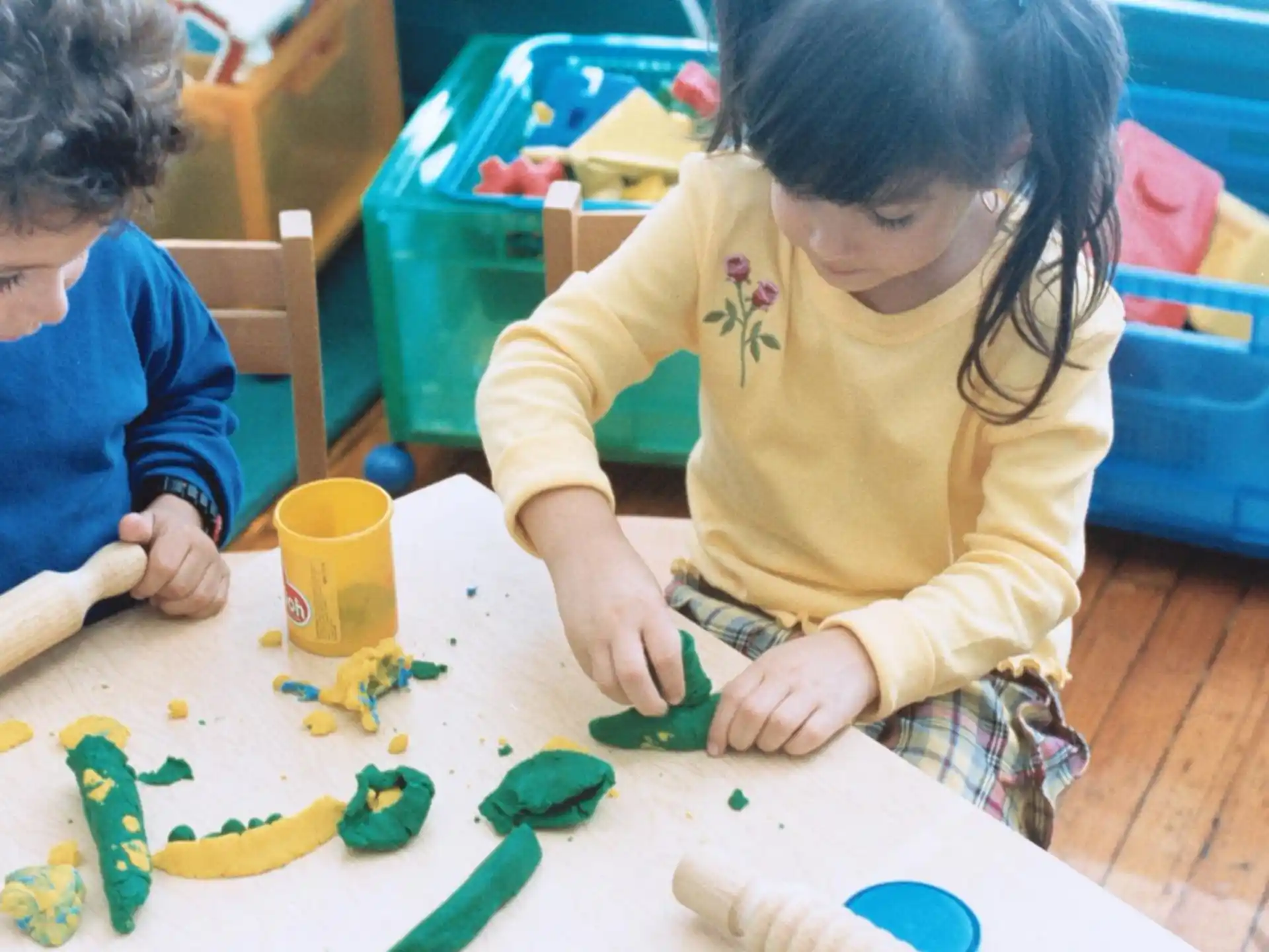 a couple of children playing with toys