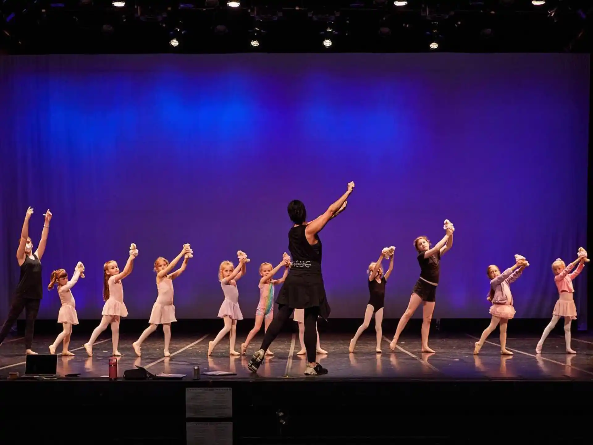 a group of people dancing on a stage