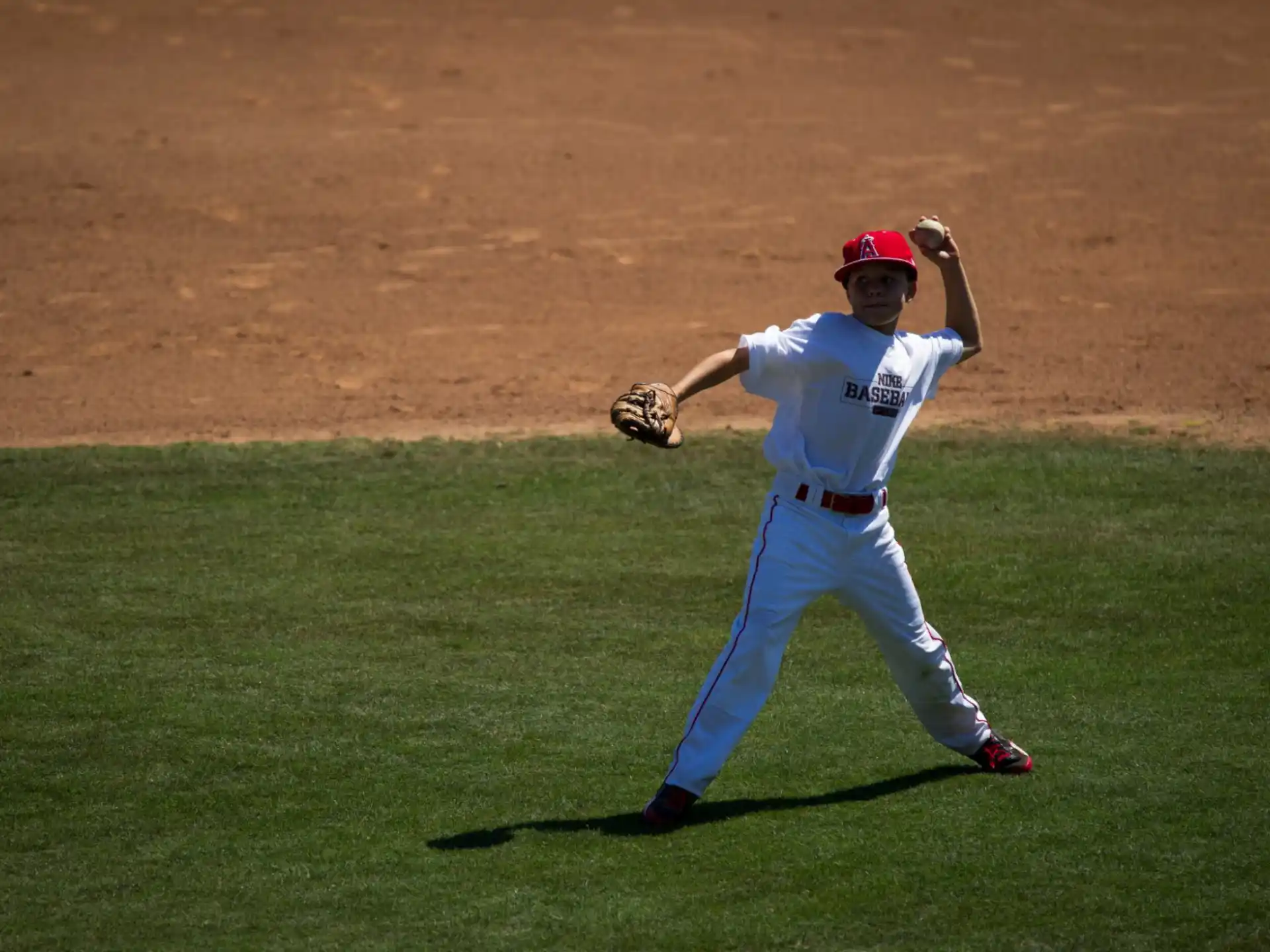 a baseball player throwing a ball