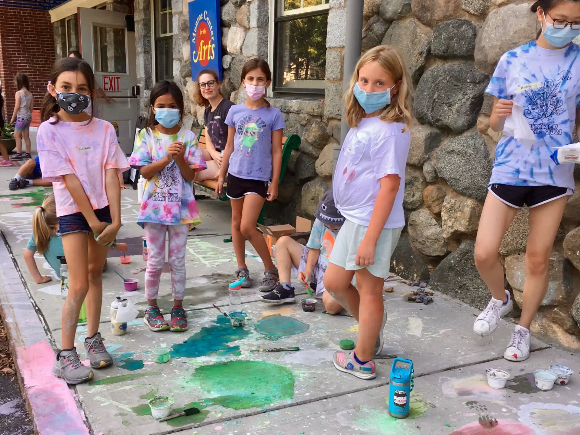a group of children wearing face masks