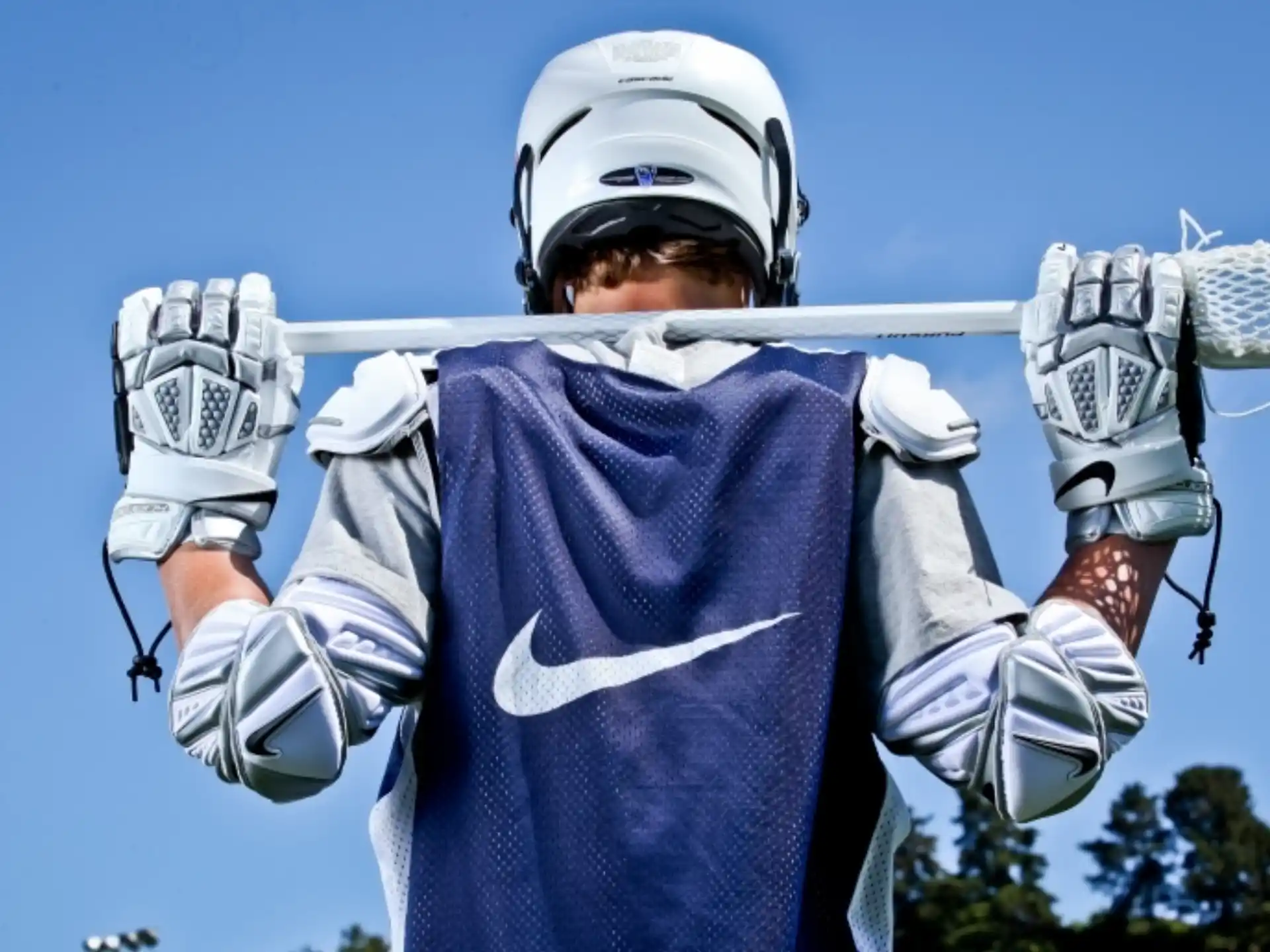 a man wearing a helmet and holding a bow and arrow