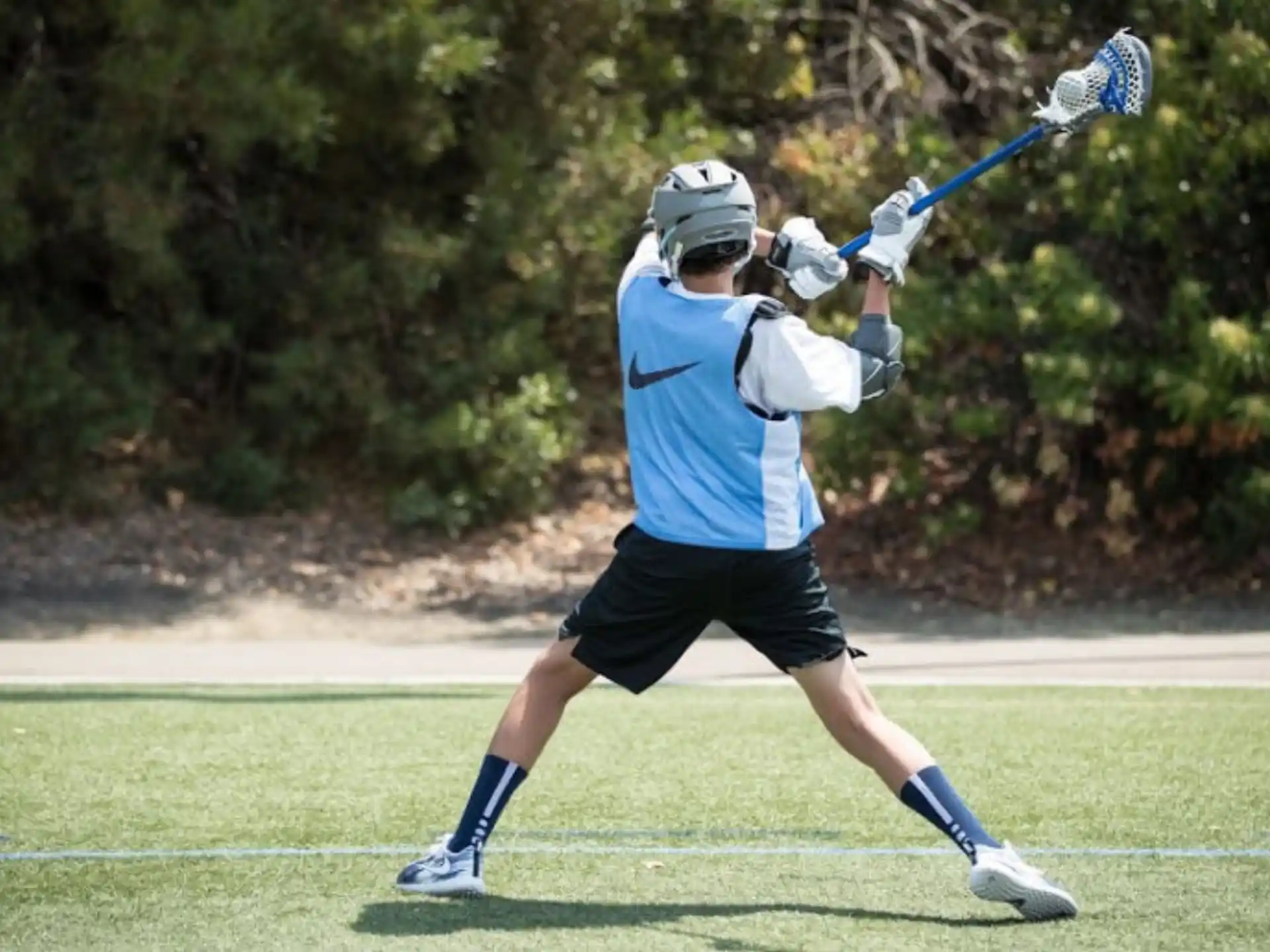 a person swinging a baseball bat