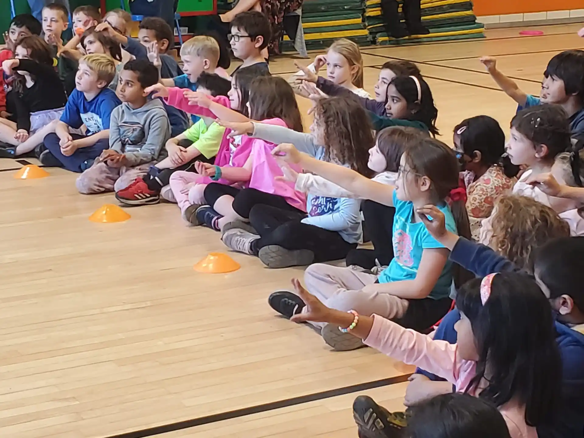 a group of children sitting on the floor
