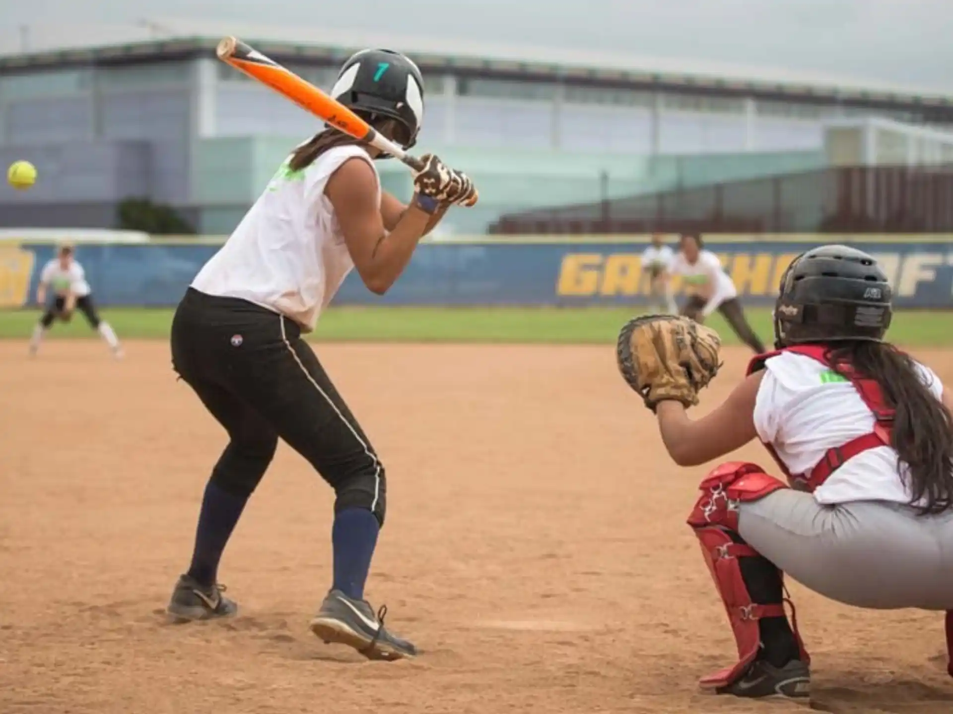 a person swinging a baseball bat