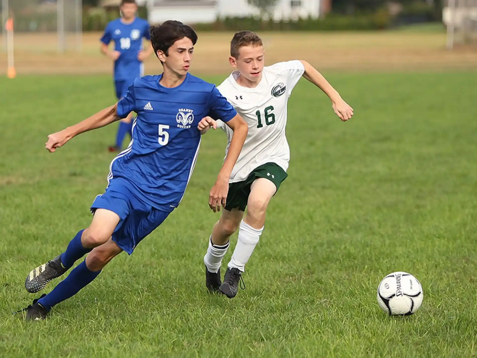 a couple of young men playing football