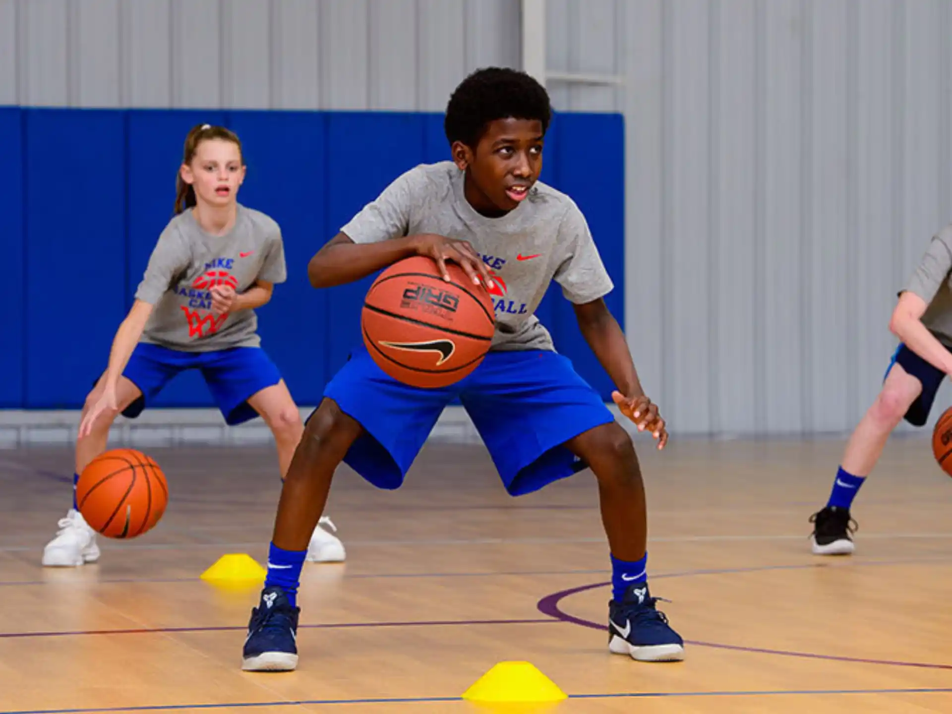 a group of people playing basketball