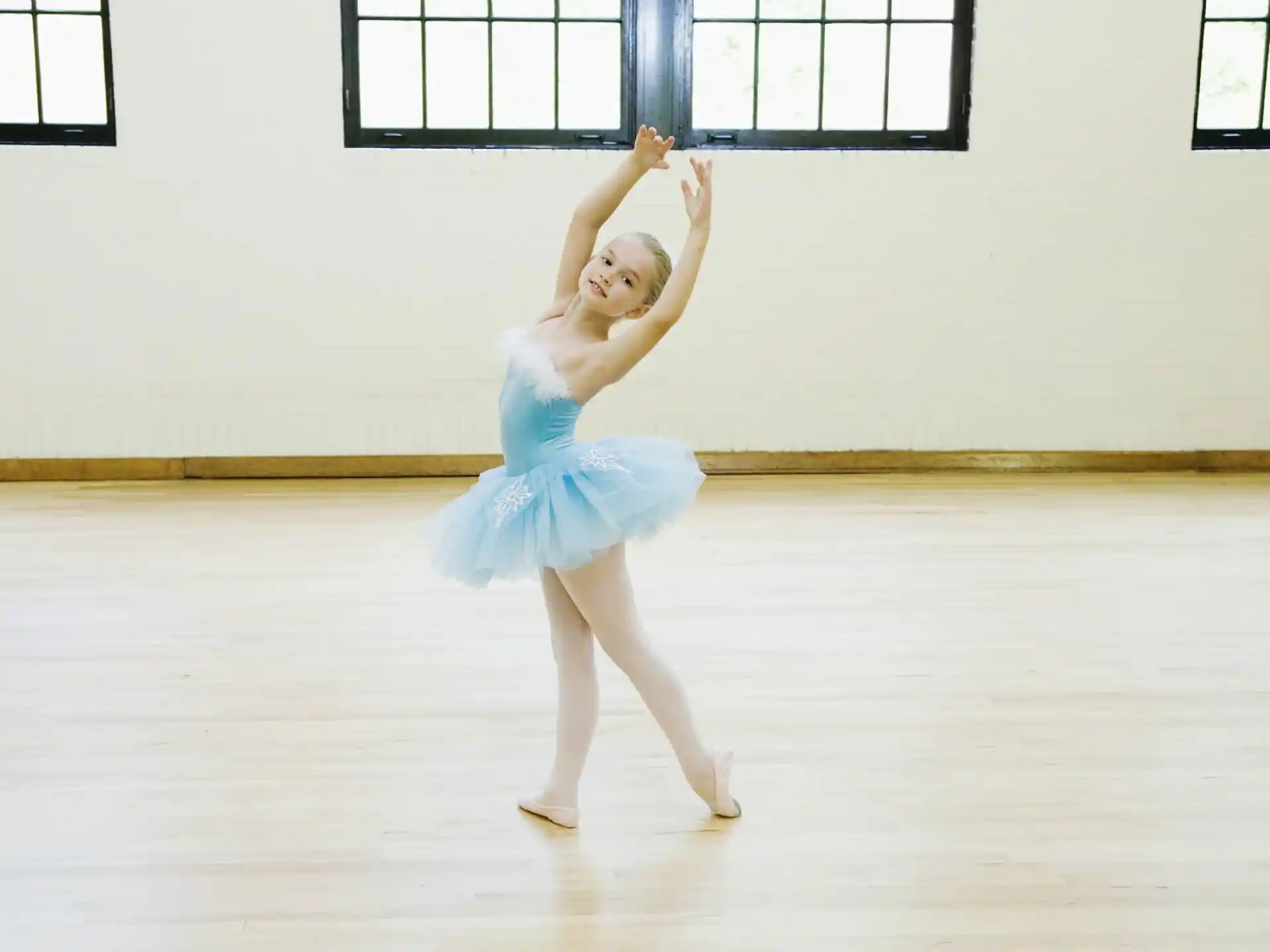a person in a blue dress dancing