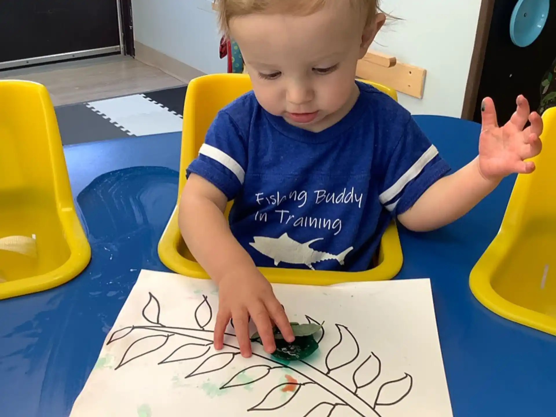 a child sitting at a table