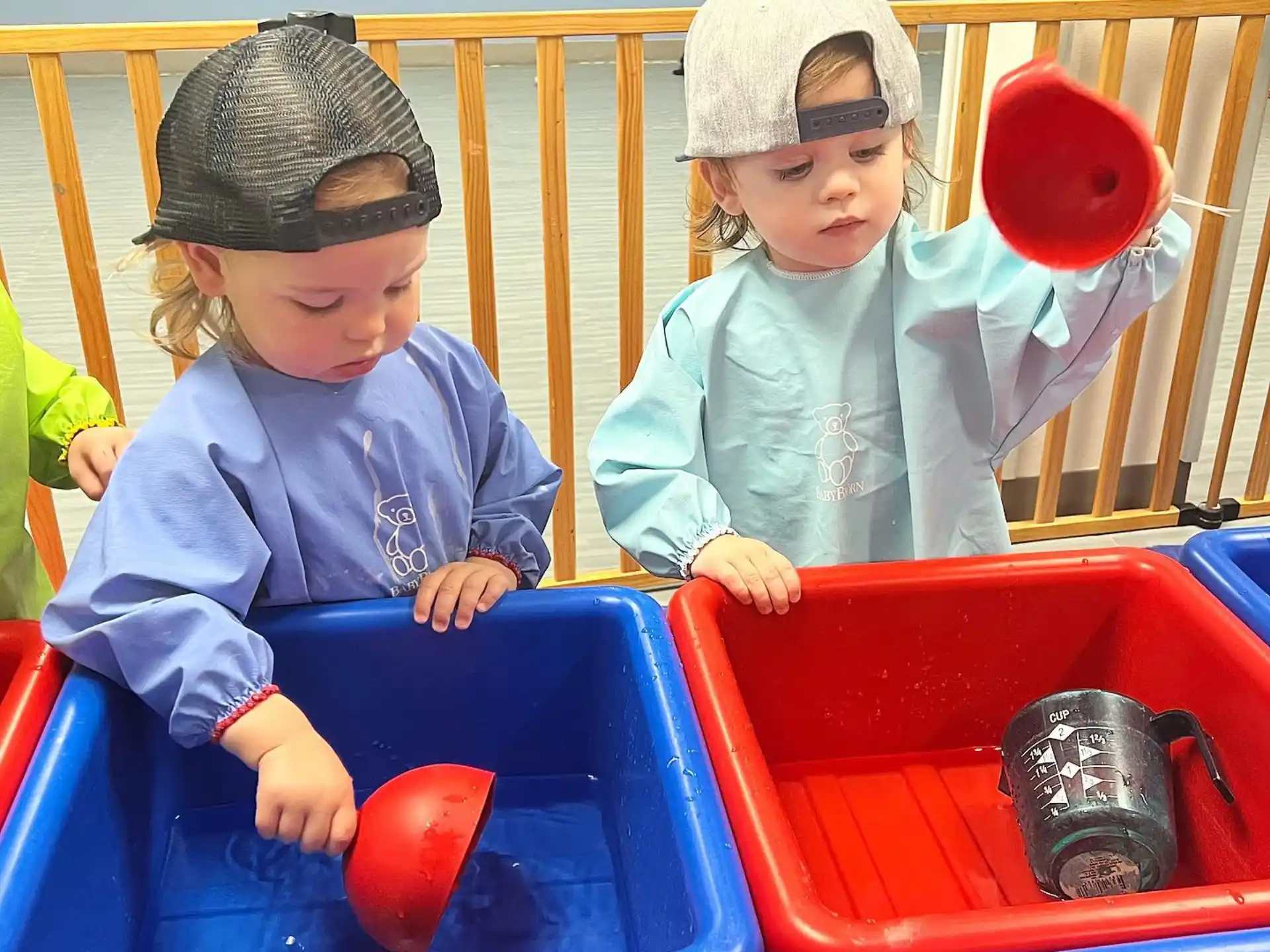 a couple of kids playing in a play set