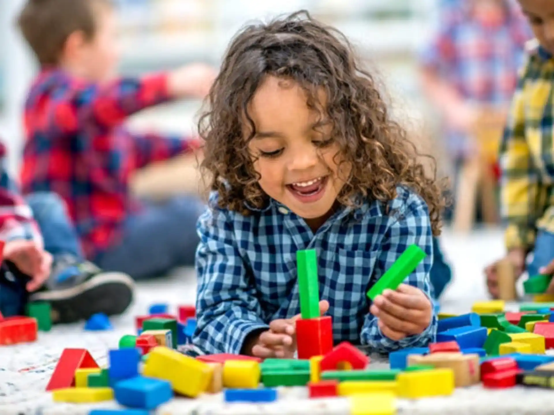 a young girl playing with toys
