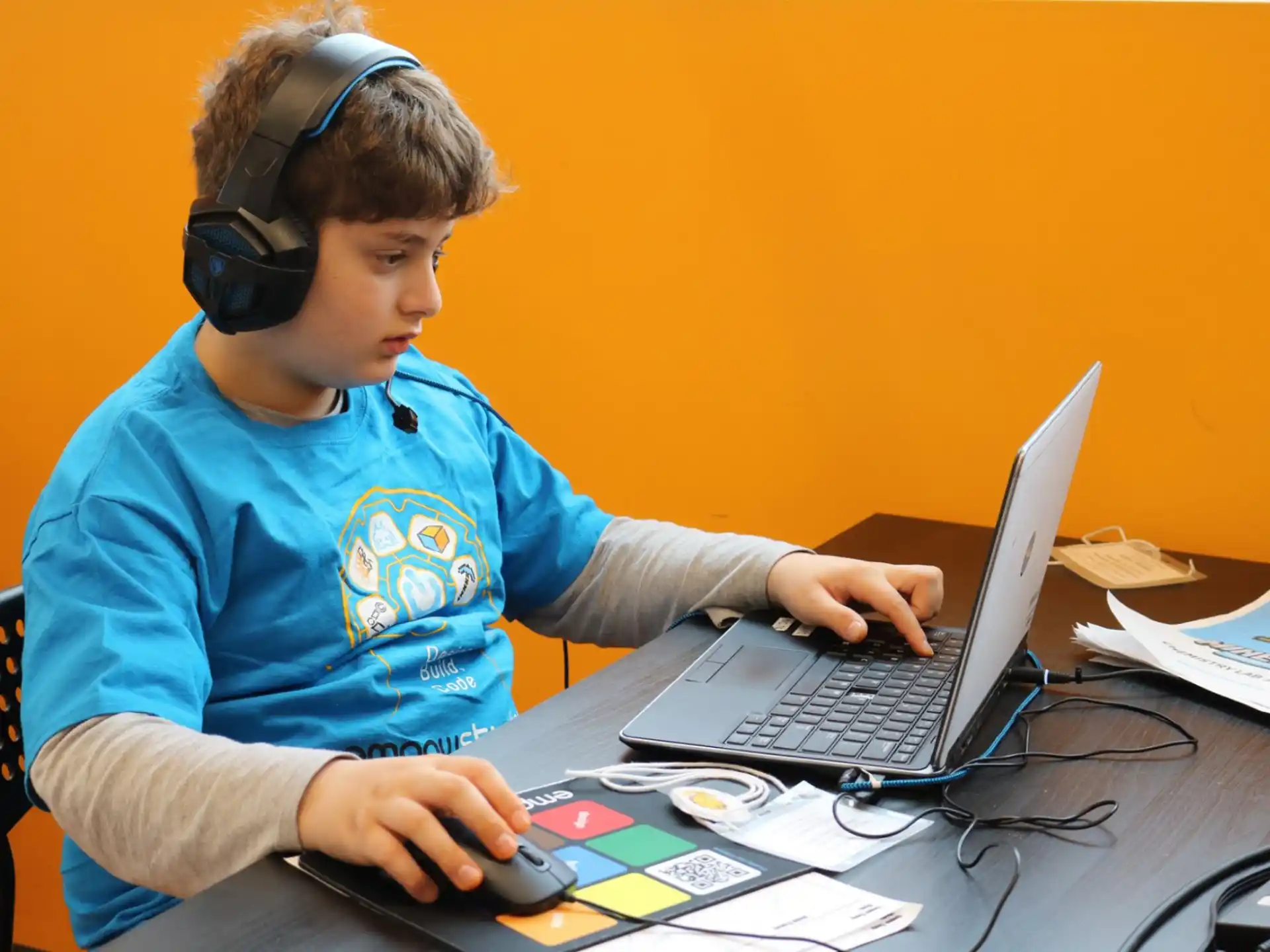 a boy using a laptop