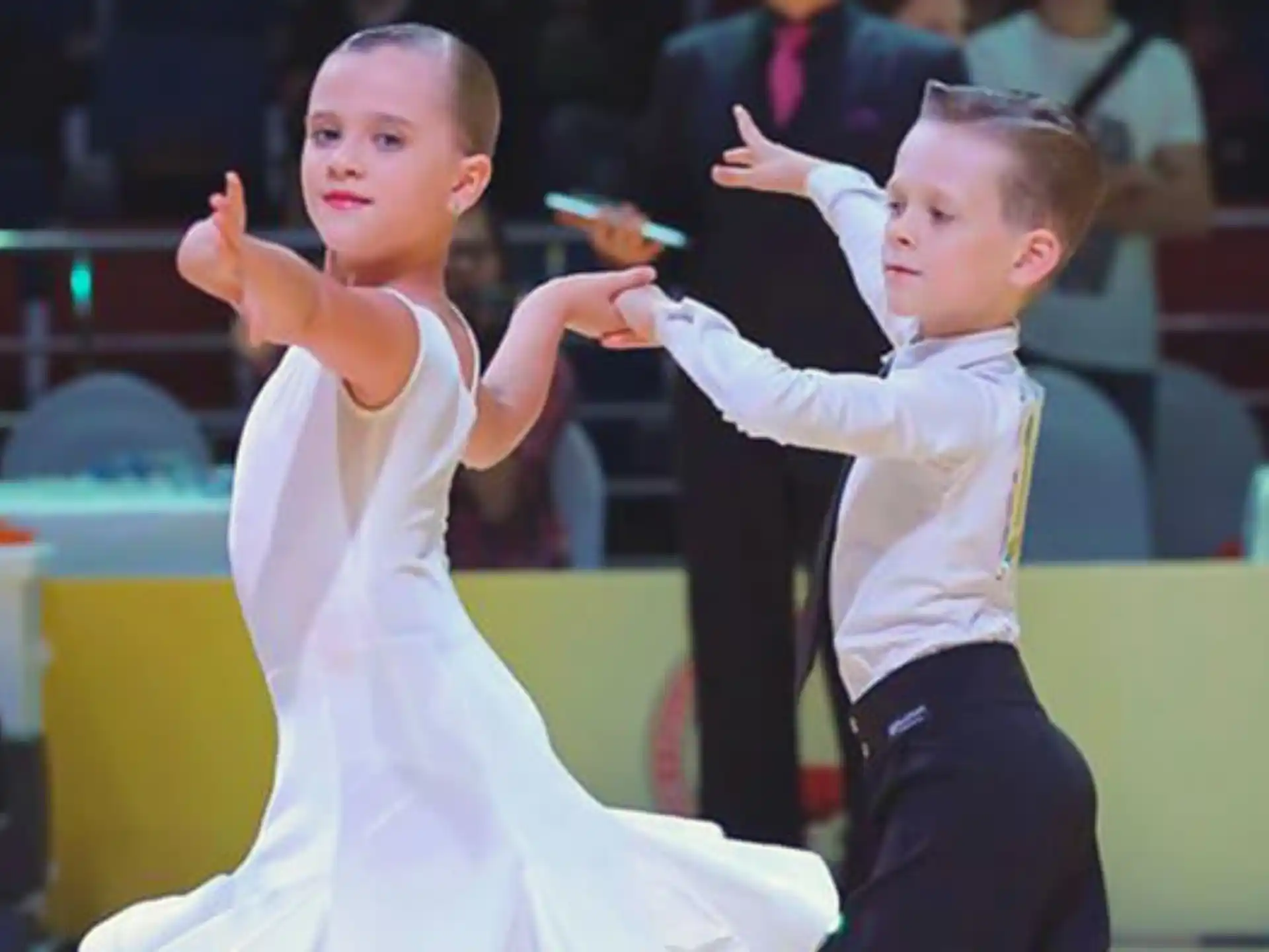 a couple of children dancing