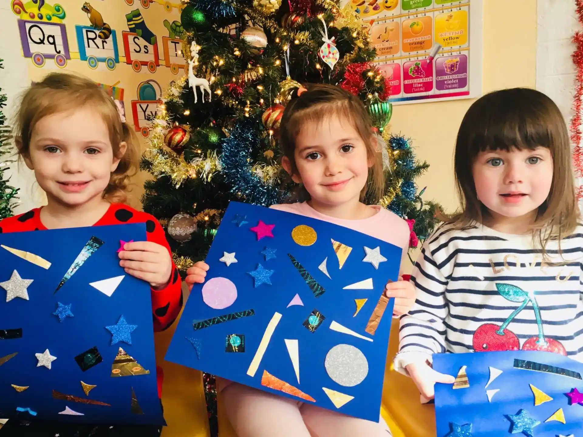 a group of children holding presents
