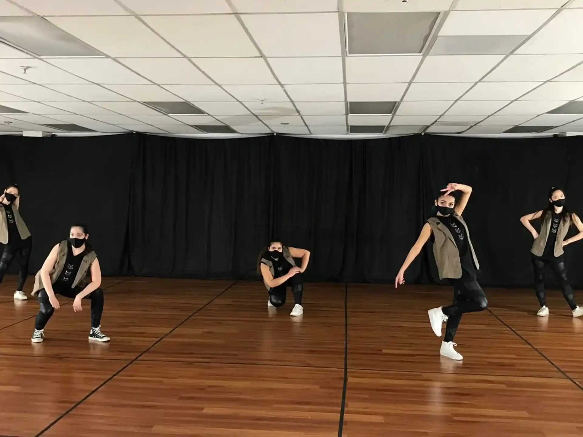 a group of people dancing on a stage