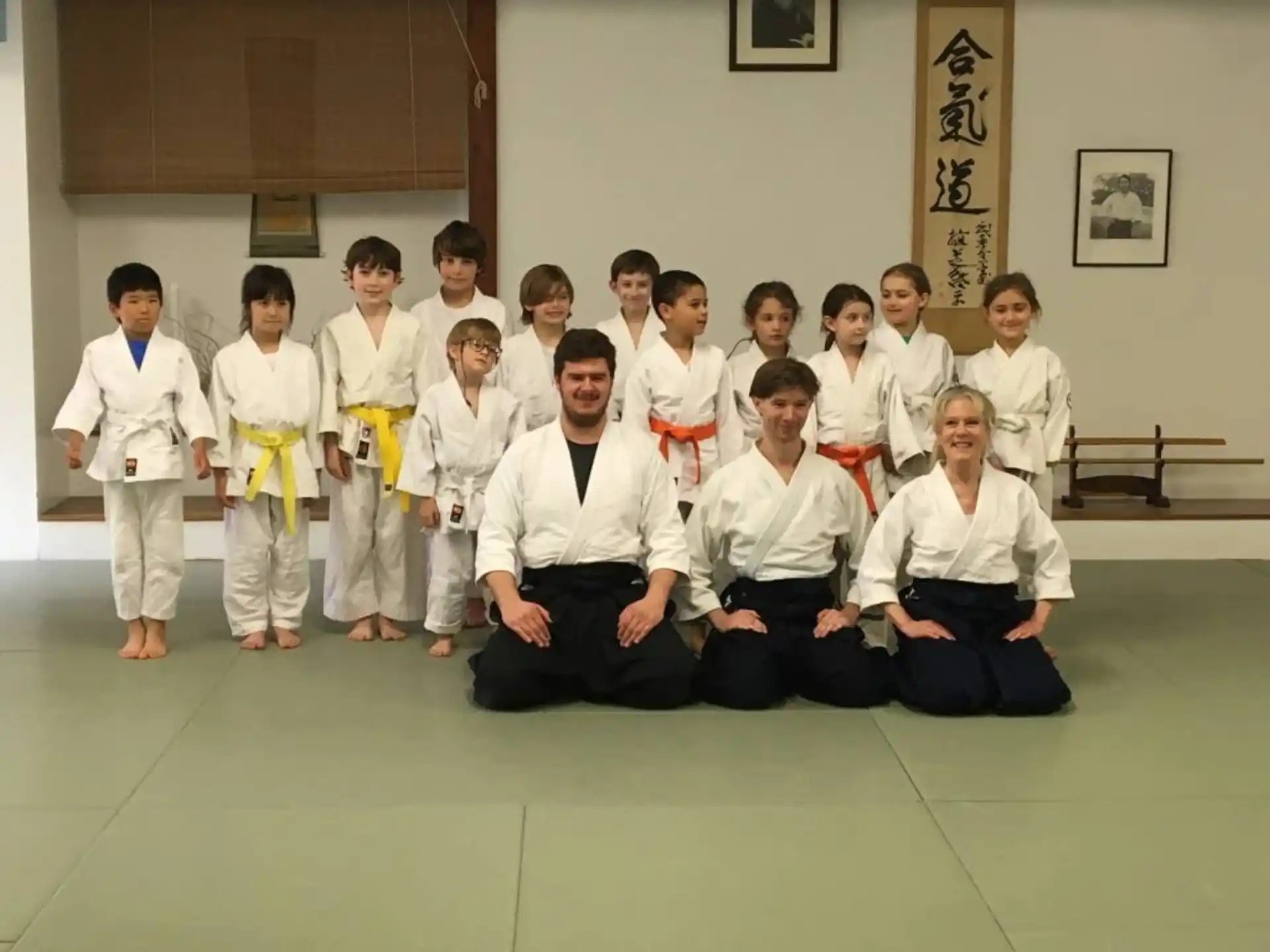a group of people in karate uniforms