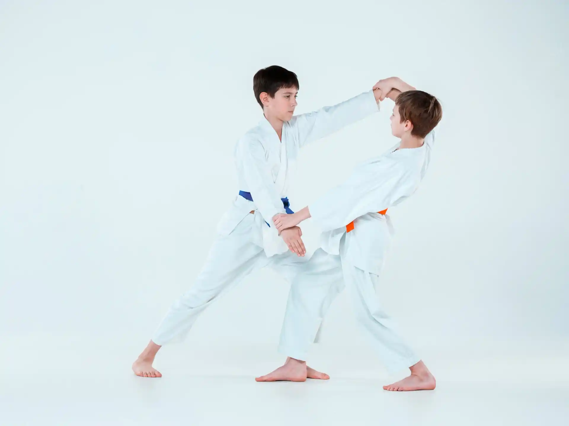 a man and a woman in karate uniforms