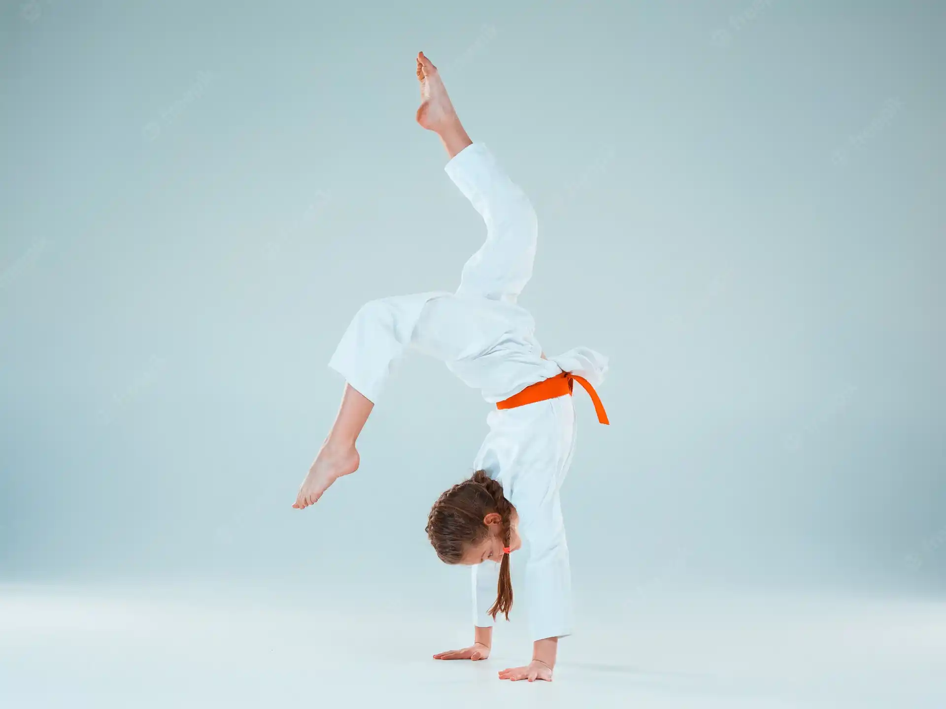a man in a karate uniform
