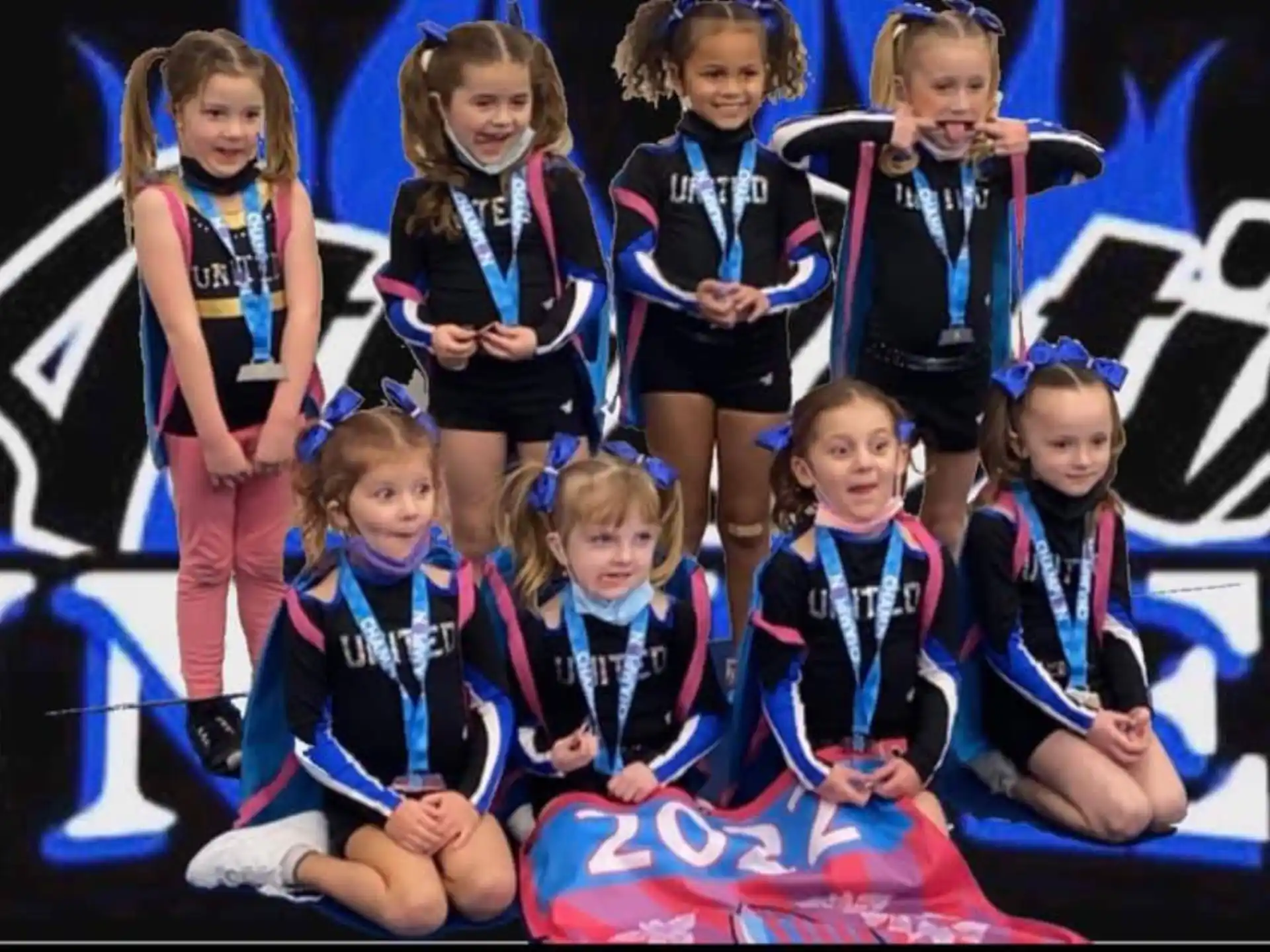 a group of cheerleaders posing for a photo