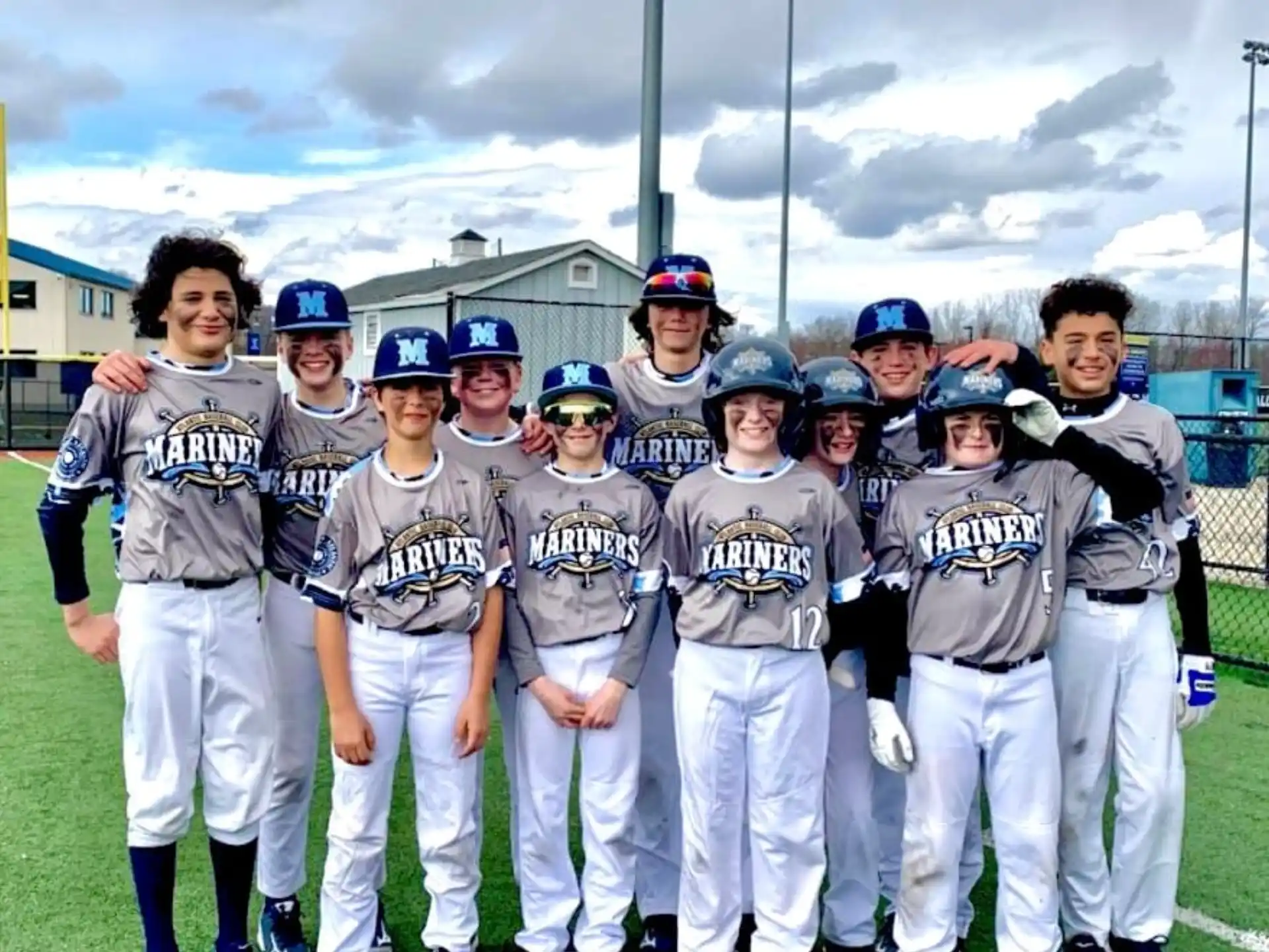 a group of baseball players posing for a photo