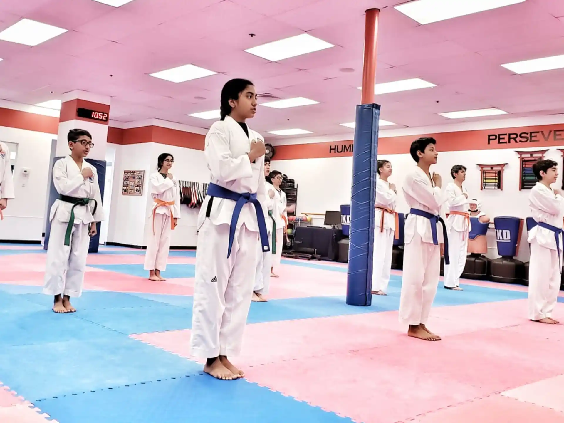 a group of people in karate uniforms