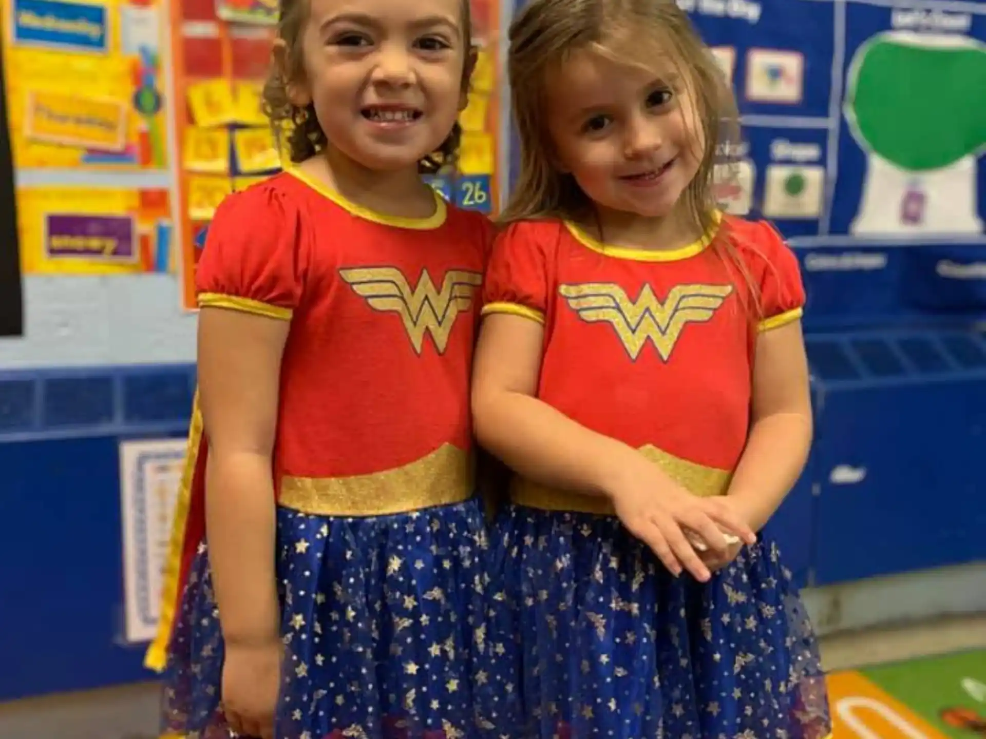 a couple of girls posing for the camera