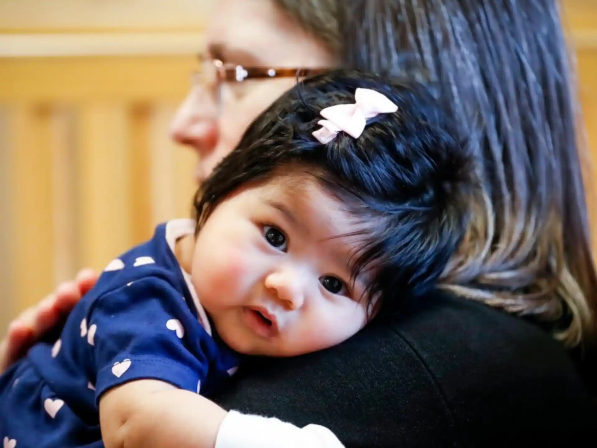 a person holding a baby