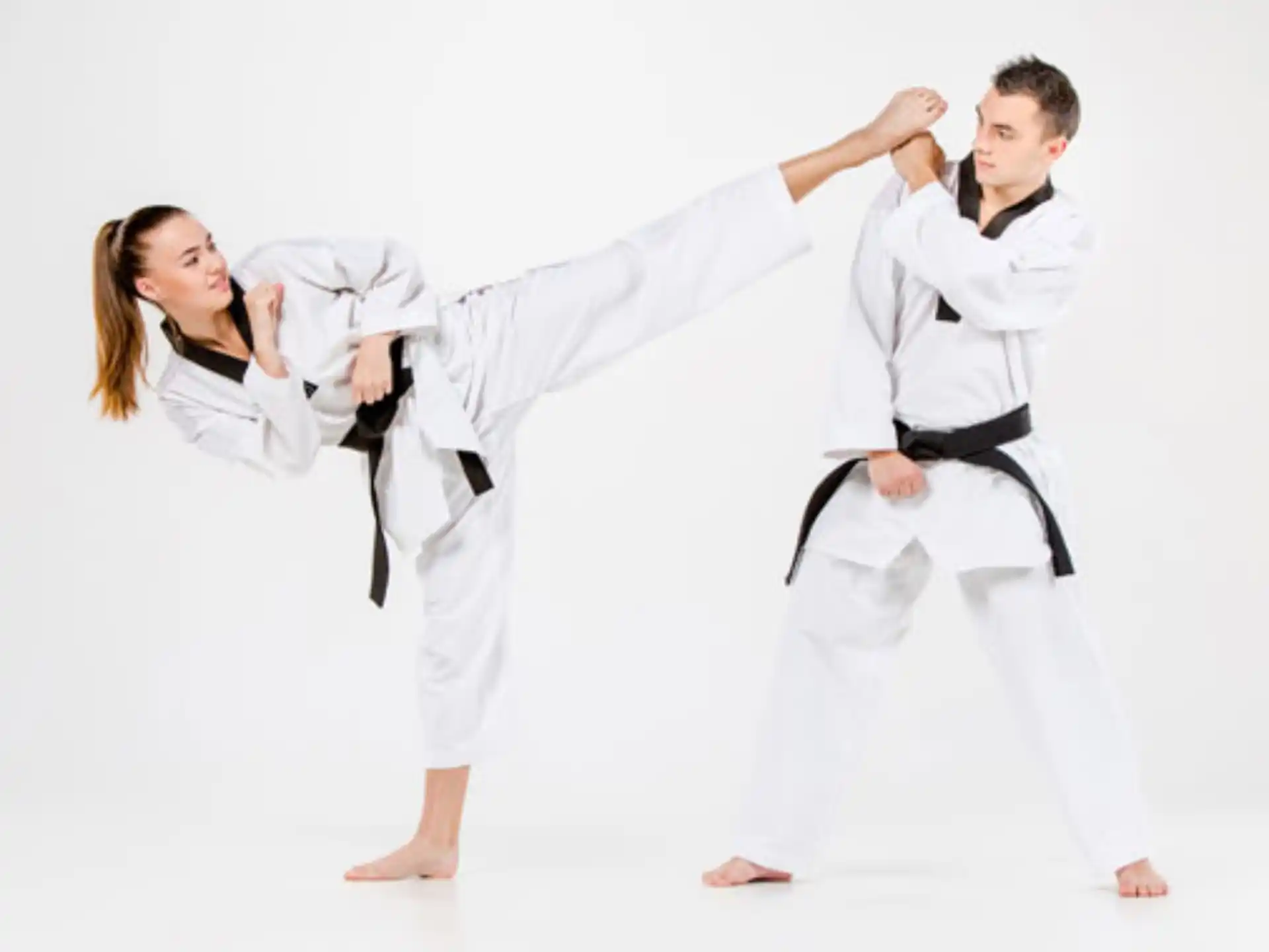 a man and a woman in karate uniforms