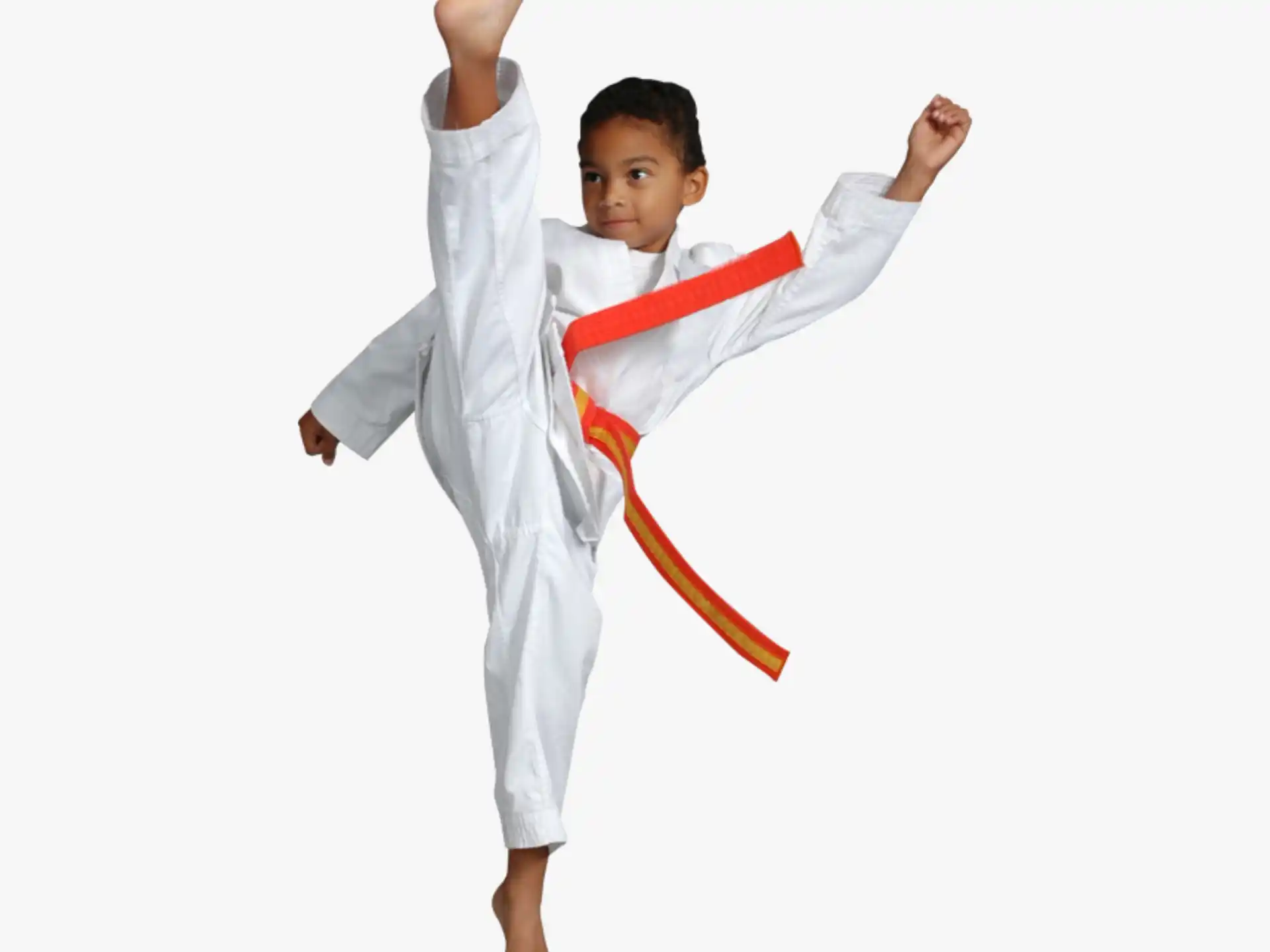 a young boy in a karate uniform