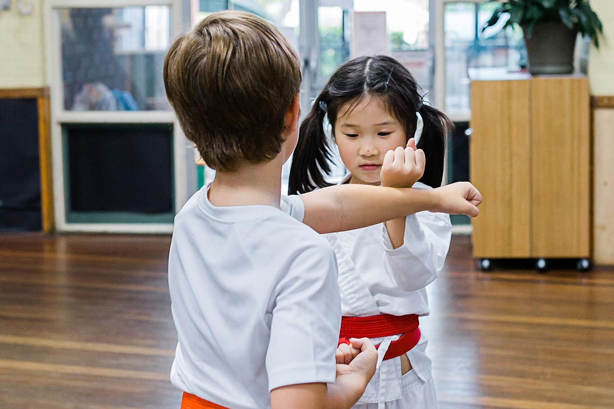 a boy and girl holding each other