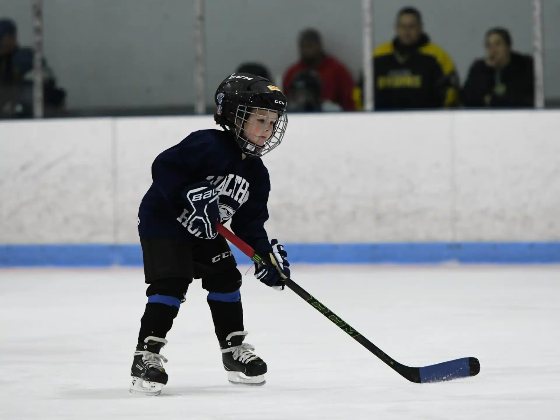 a young boy playing hockey