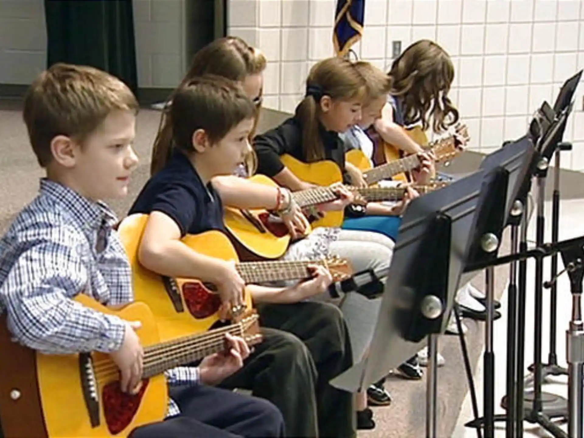 a group of kids playing instruments