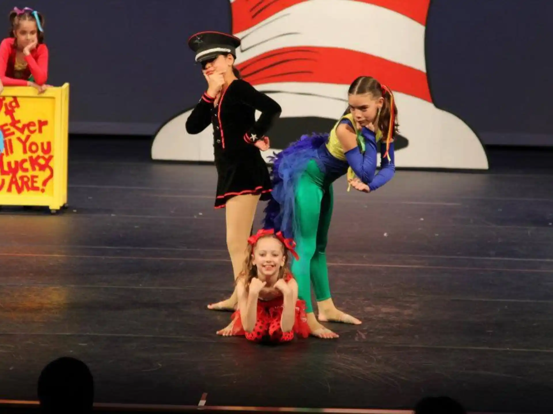 a group of people dancing on a stage