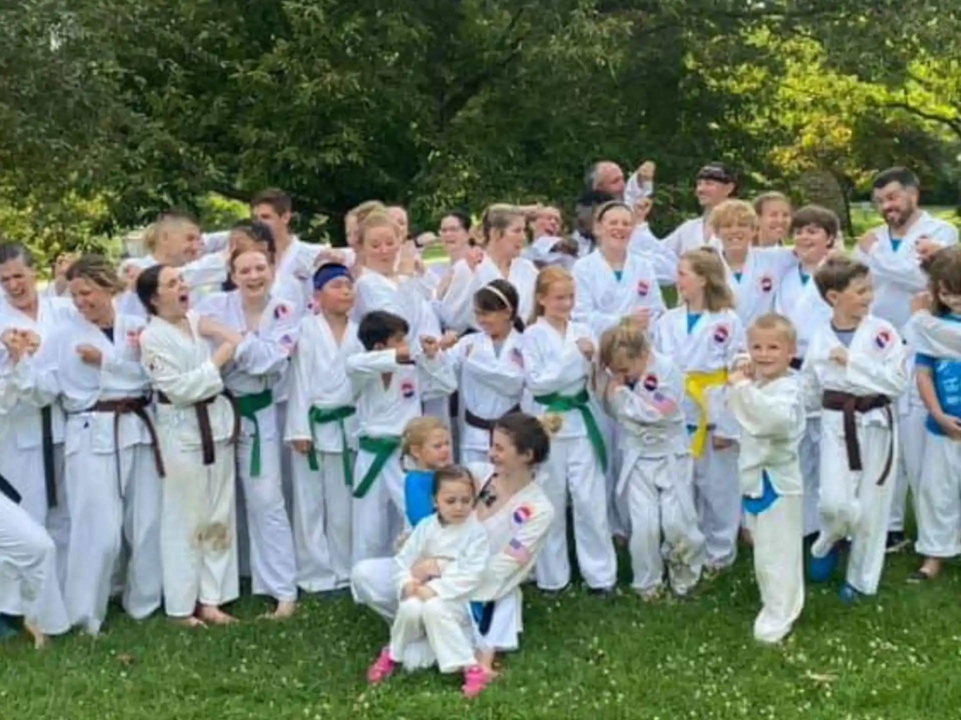 a group of people in karate uniforms