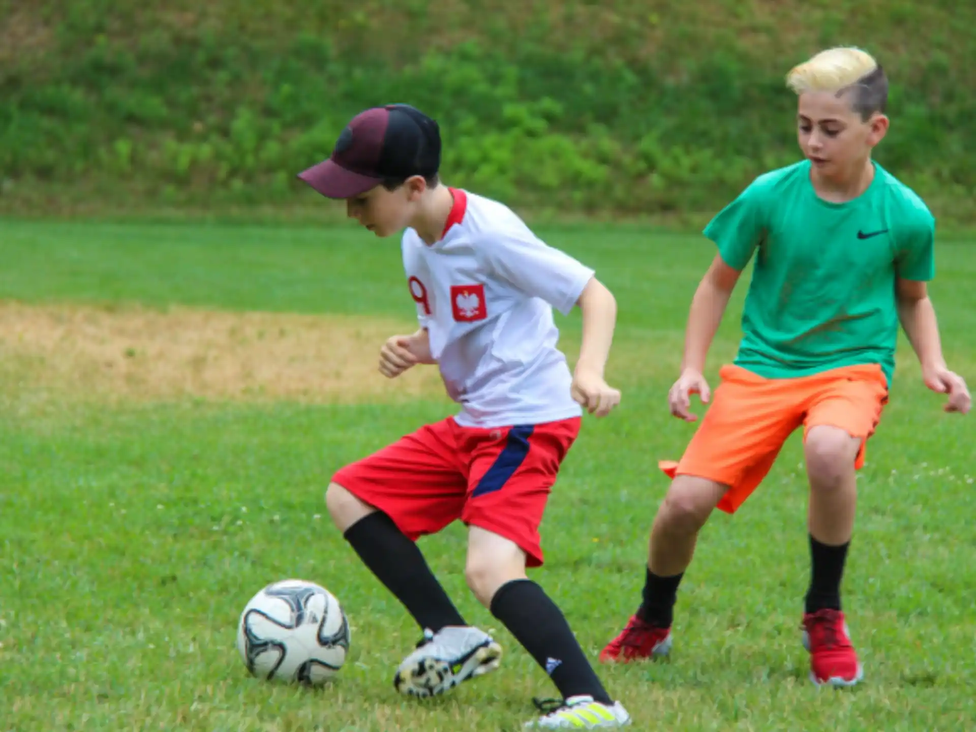 a couple of young boys playing football