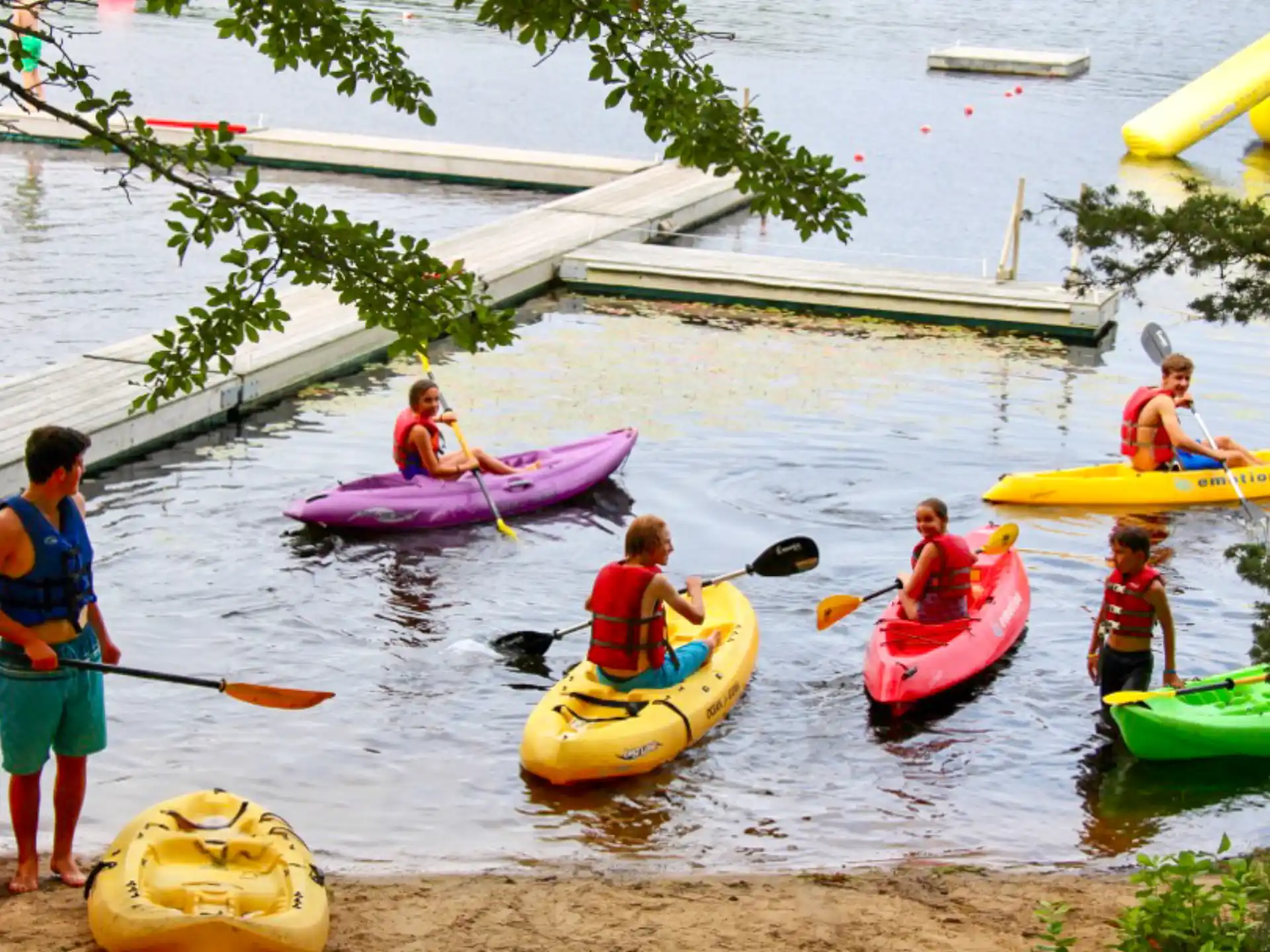a group of people in kayaks