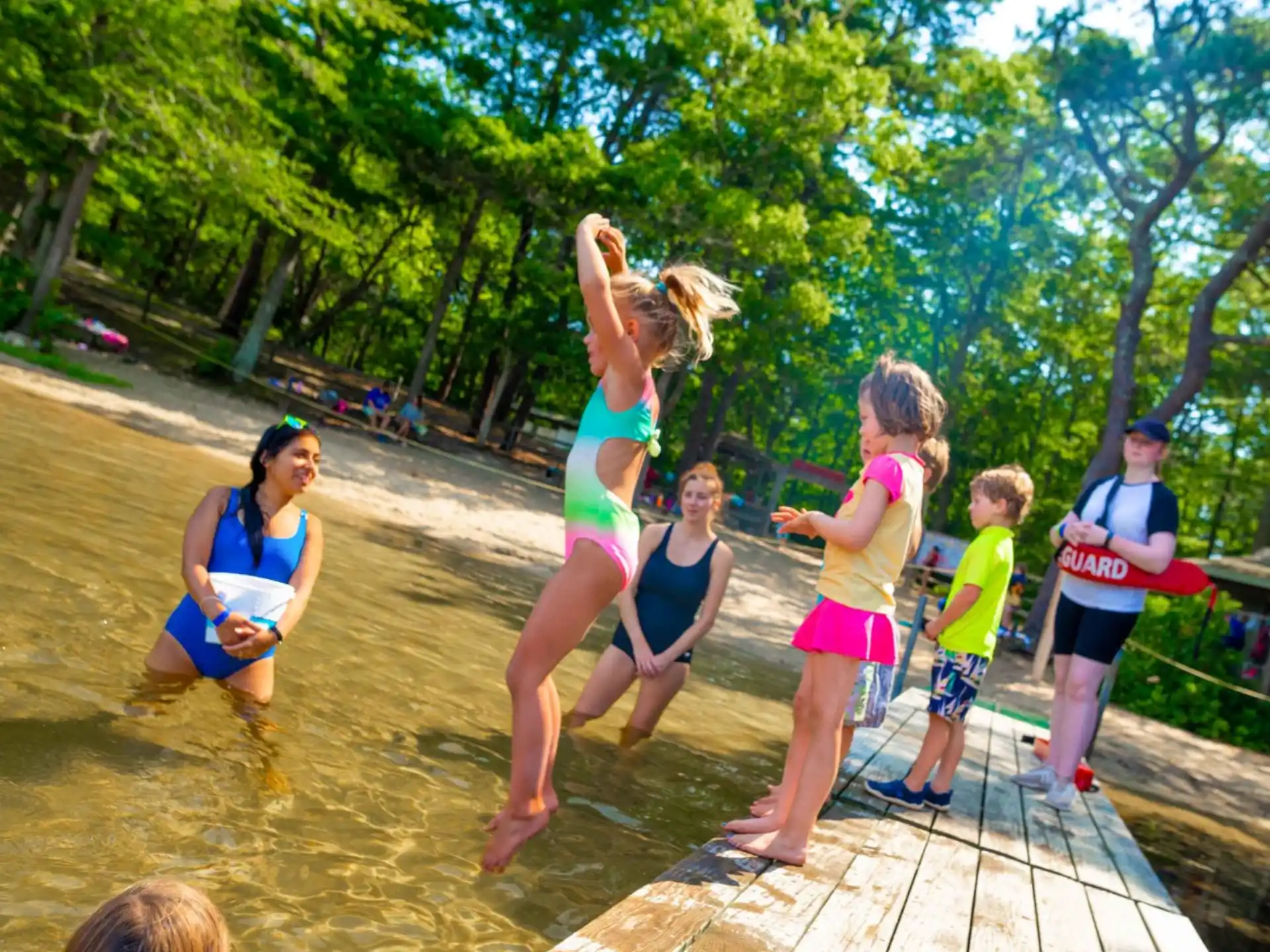 a group of people playing in a pool